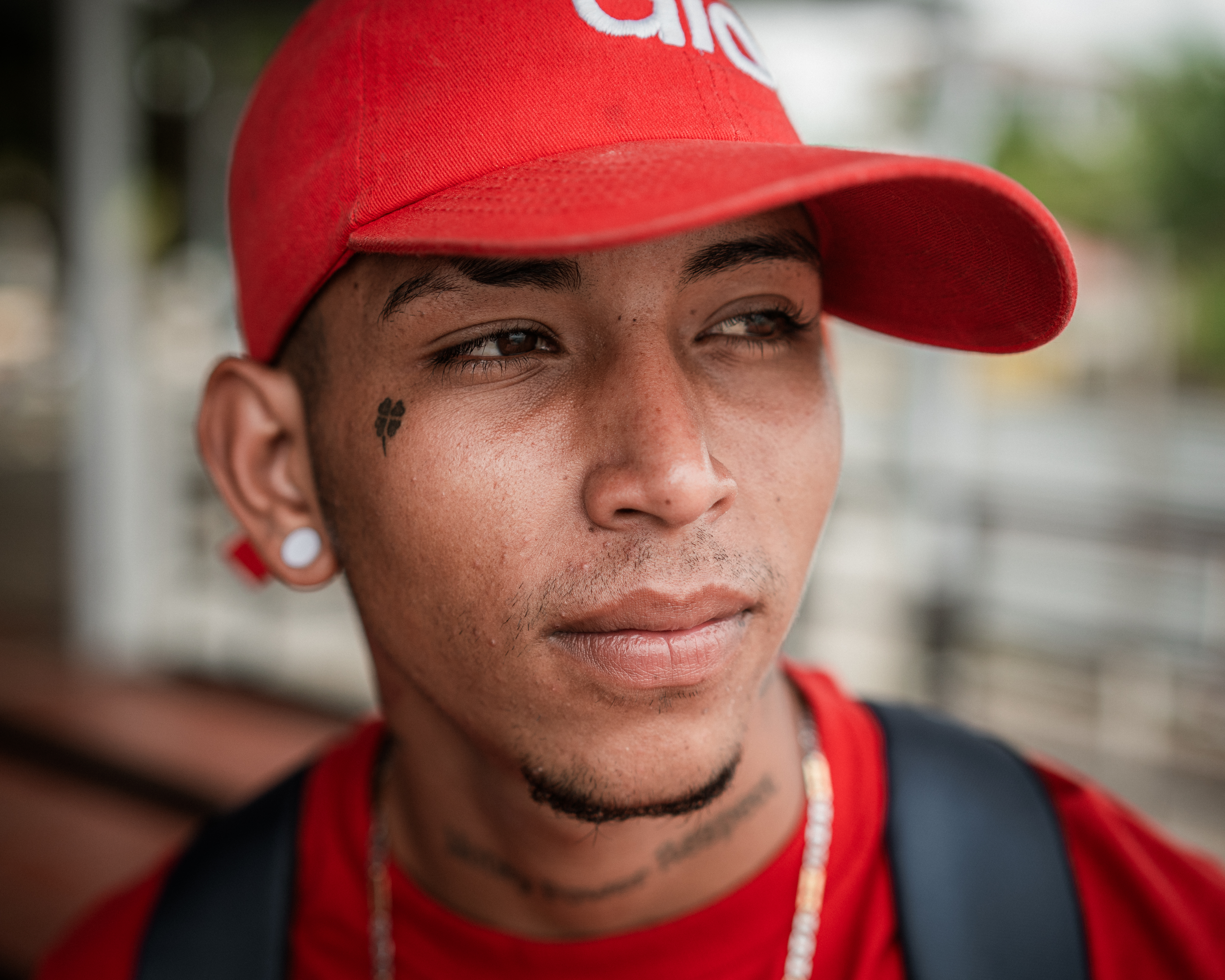 Luís Angel Yagua Parra, 21, a Venezuelan man returning south through Necoclí, who wears a red baseball cap
