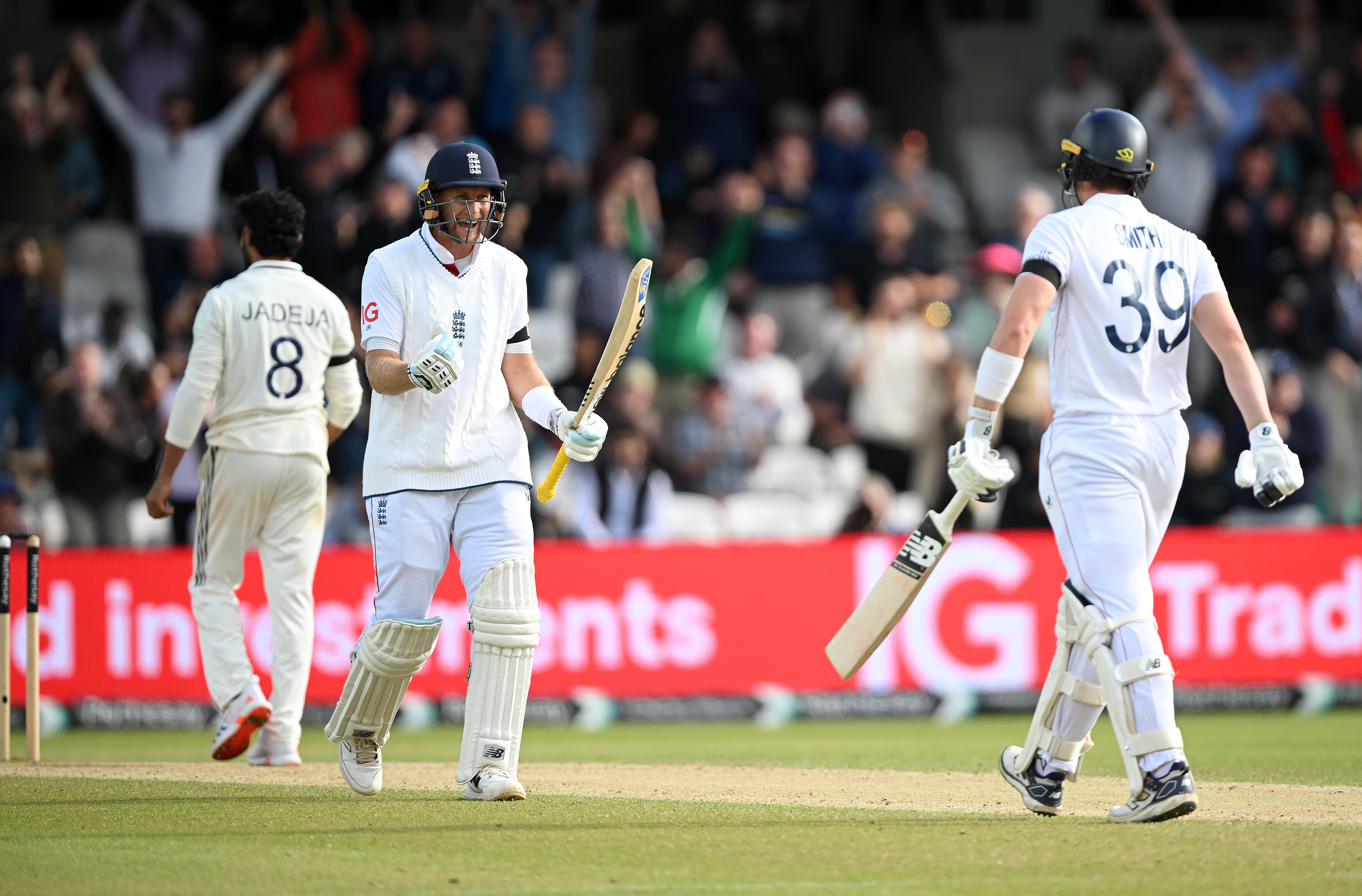Joe Root and Jamie Smith of England celebrate victory after day five of the 1st Rothesay Test Match between England and India at Headingley 