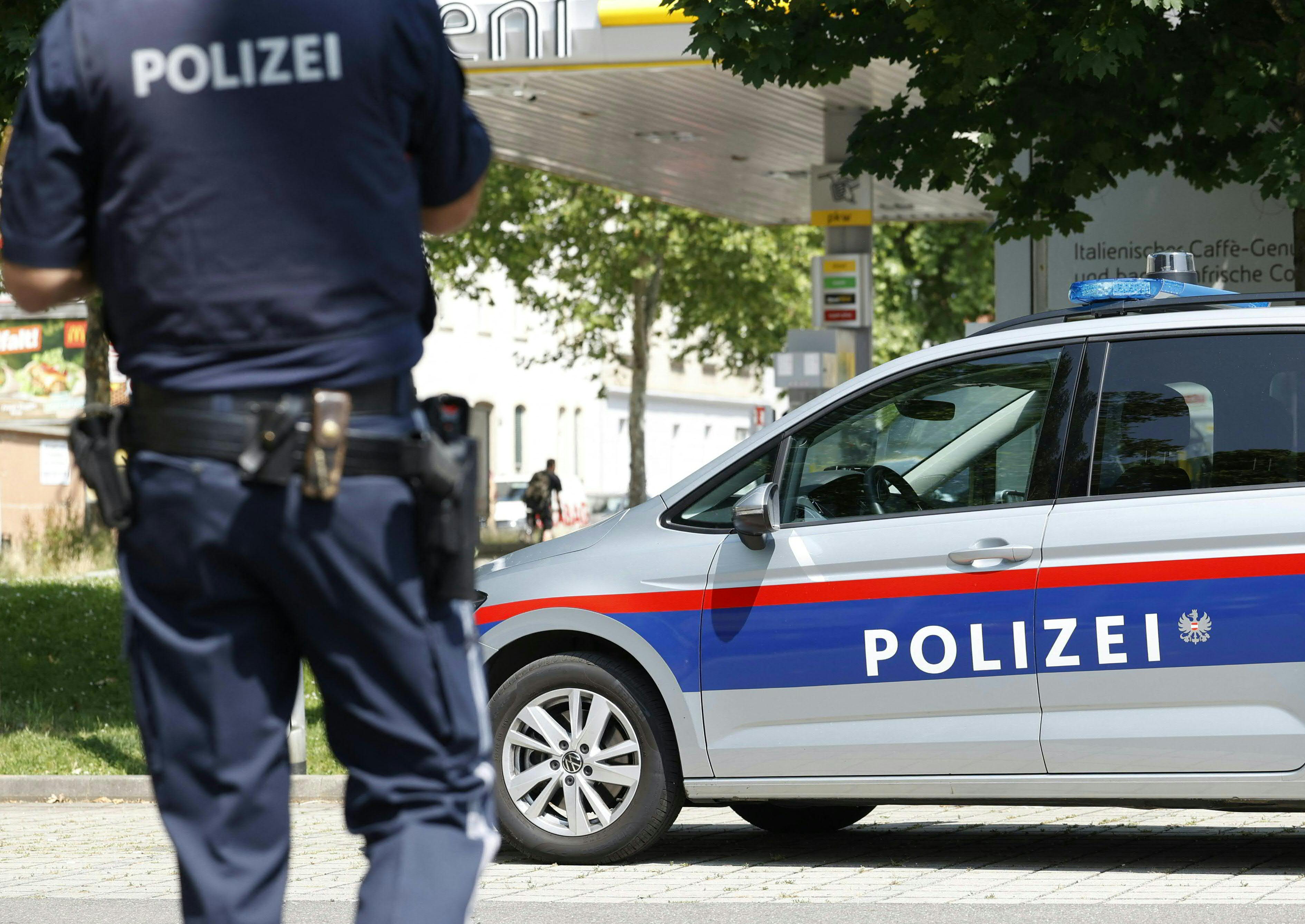 A policeman is seen close to a school where, according to reports, several people died in a shooting, on June 10, 2025 in Graz, southeastern Austria.