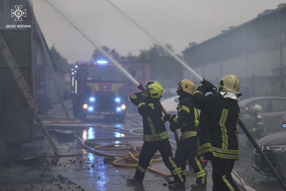 A handout picture made available by the State Emergency Service shows Ukrainian emergency services working at the site of a drone strike in the Kyiv area, Ukraine