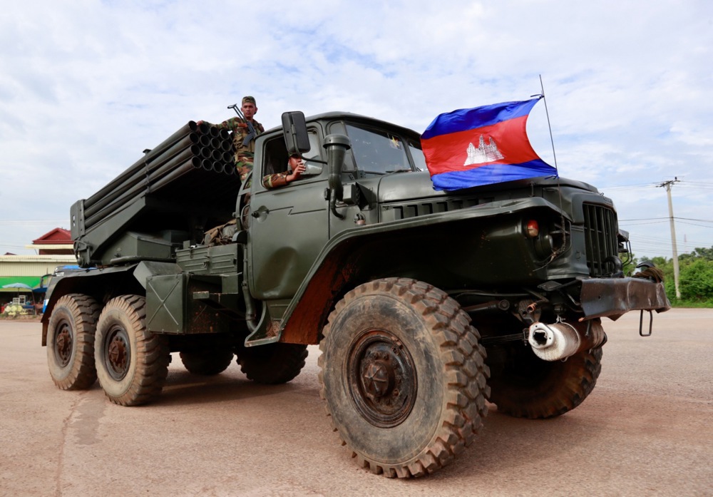 Cambodian soldiers ride on a self-propelled multiple rocket launcher in Oddar Meanchey province, Cambodia, 25 July 2025. [File: Kith Serey/EPA]