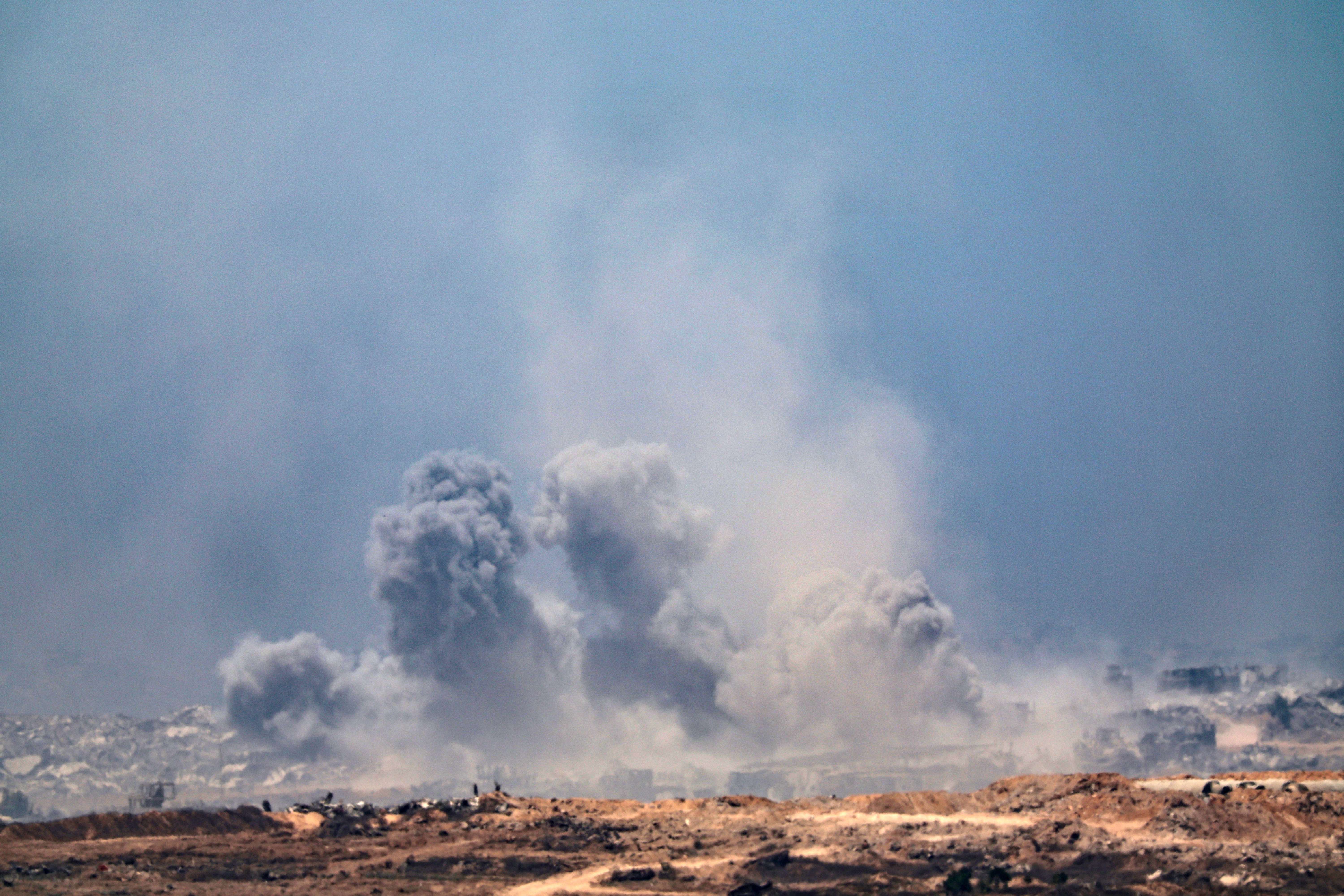 epa12265524 Smoke rises from an Israeli airstrike in the northern part of the Gaza Strip near Beit Hanoun, as seen from the Israeli side of the border, 27 July 2025. EPA/ATEF SAFADI