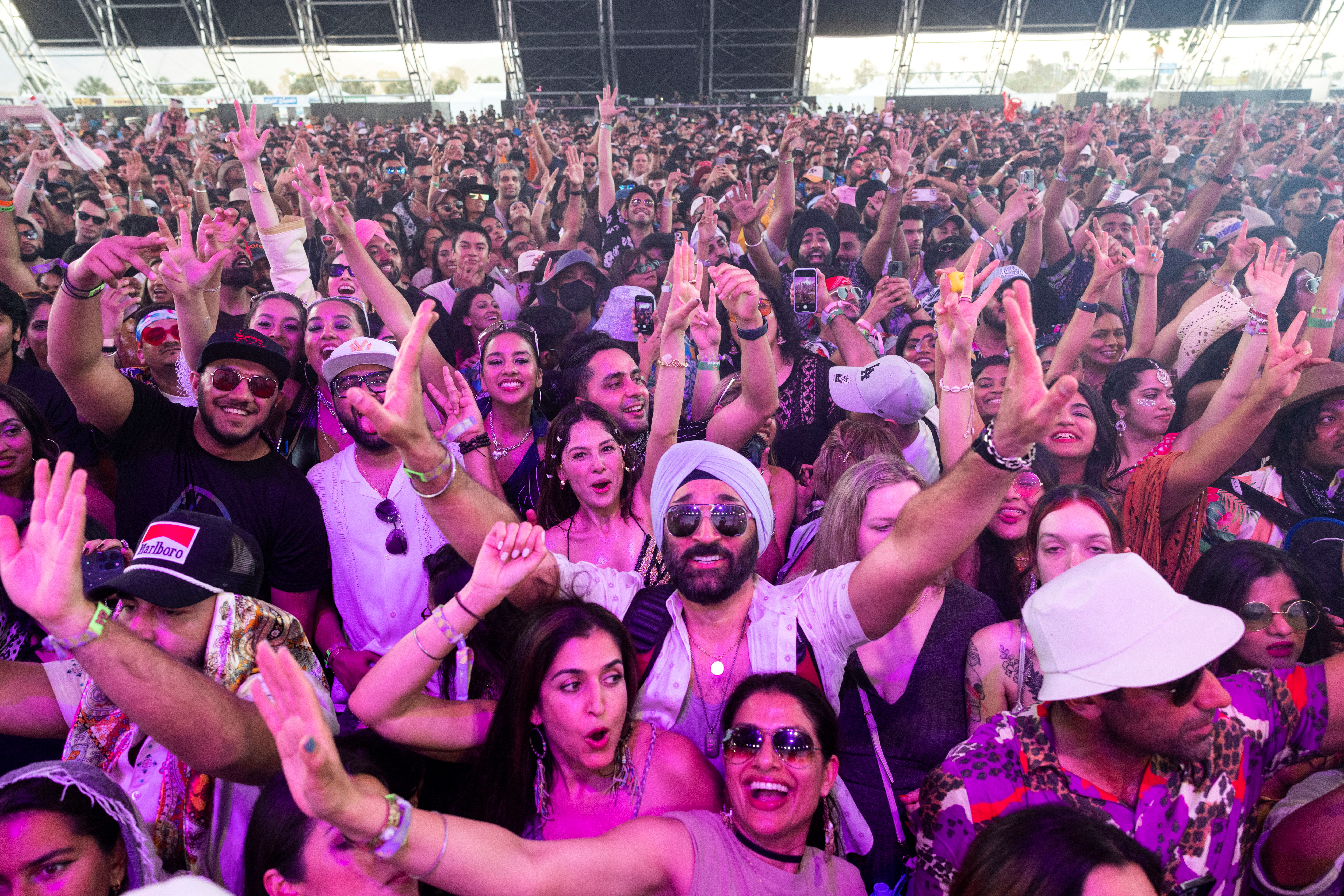 Spectators watch Diljit Dosanjh perform onstage at the Coachella Valley Music & Arts Festival in Indio, California, U.S., April 22, 2023. REUTERS/Aude Guerrucci