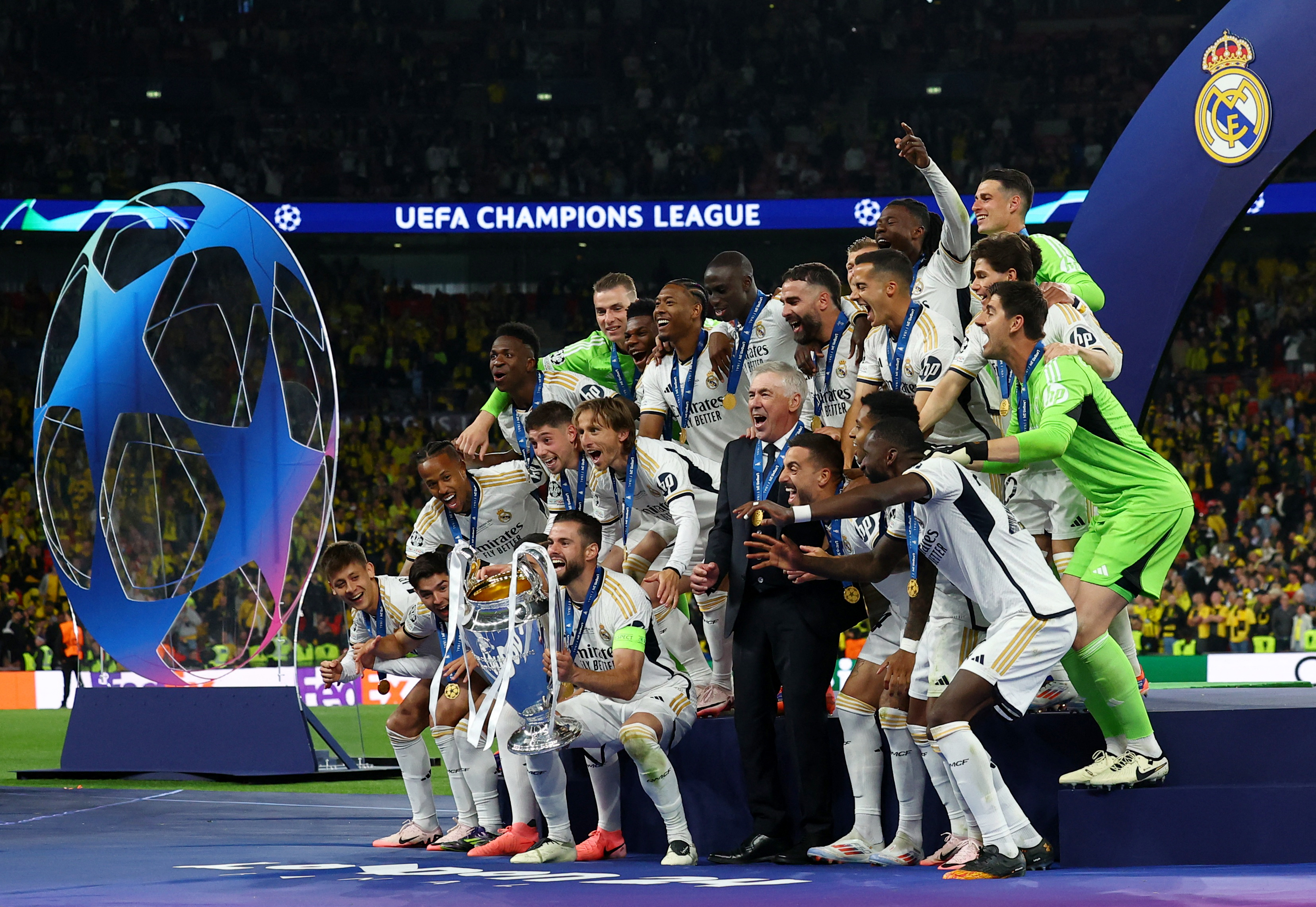 Champions League - Final - Borussia Dortmund v Real Madrid - Real Madrid's Nacho lifts the trophy as he celebrates with teammates after winning the Champions League