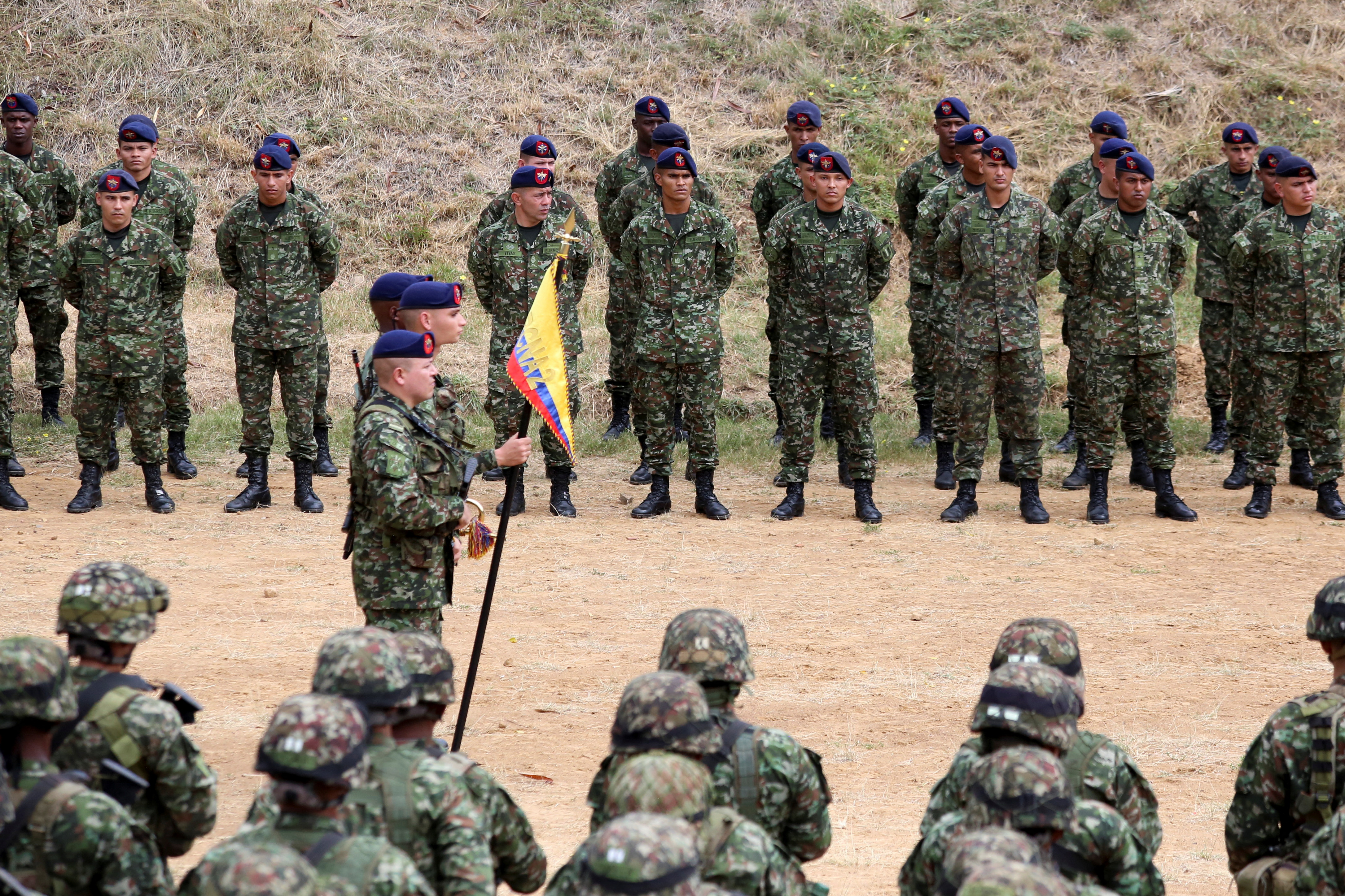 Colombian soldiers stand in formation