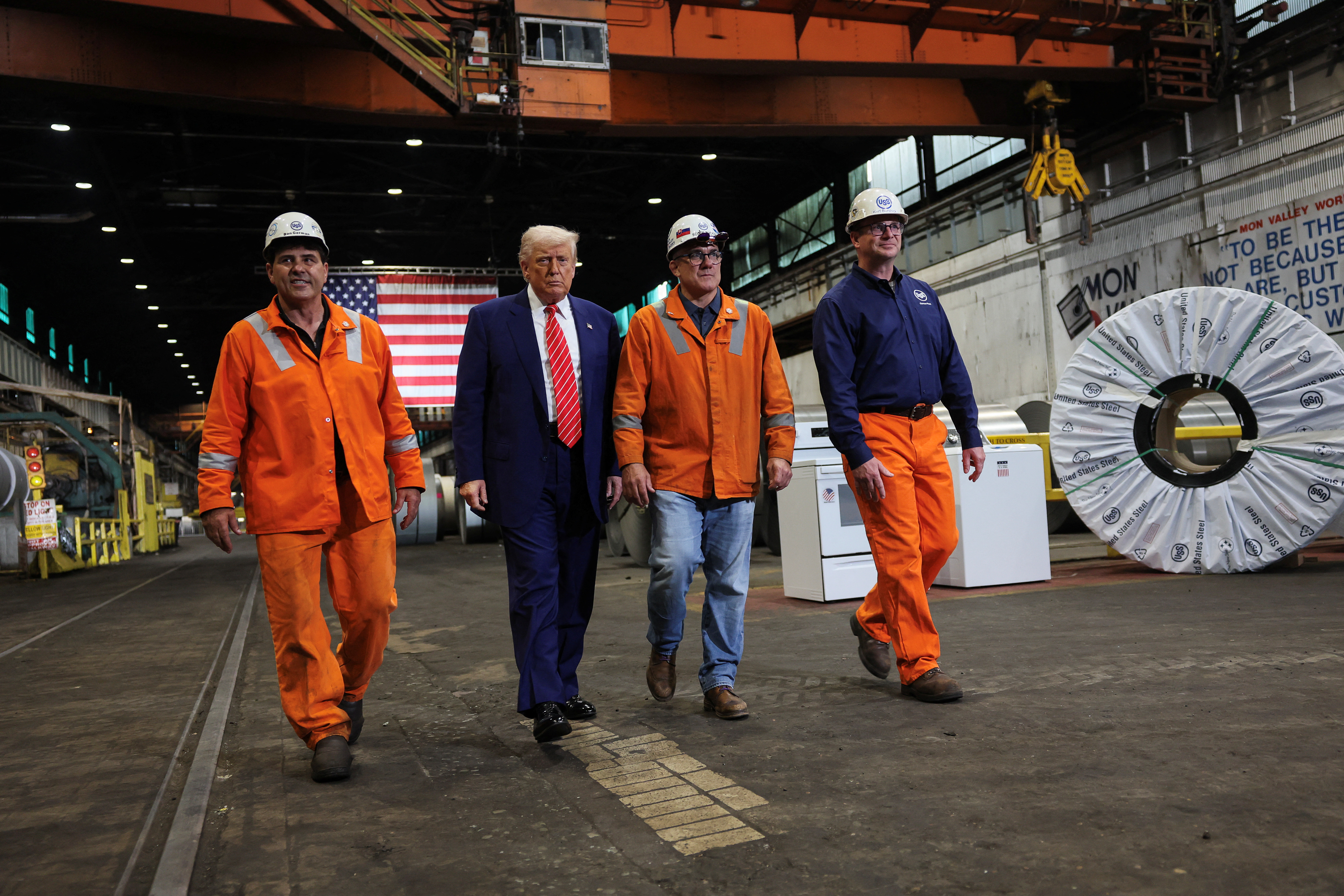 U.S. President Donald Trump walks with North American Flat-Rolled Segment Senior Vice President and Chief Manufacturing Officer Scott Buckiso, Plant manager of Irvin and Fairless Plant Donald German and Mon Valley Works United Steel Corporation Vice President Kurt Barshick, as he visits U.S. Steel Corporation–Irvin Works in West Mifflin, Pennsylvania, U.S.