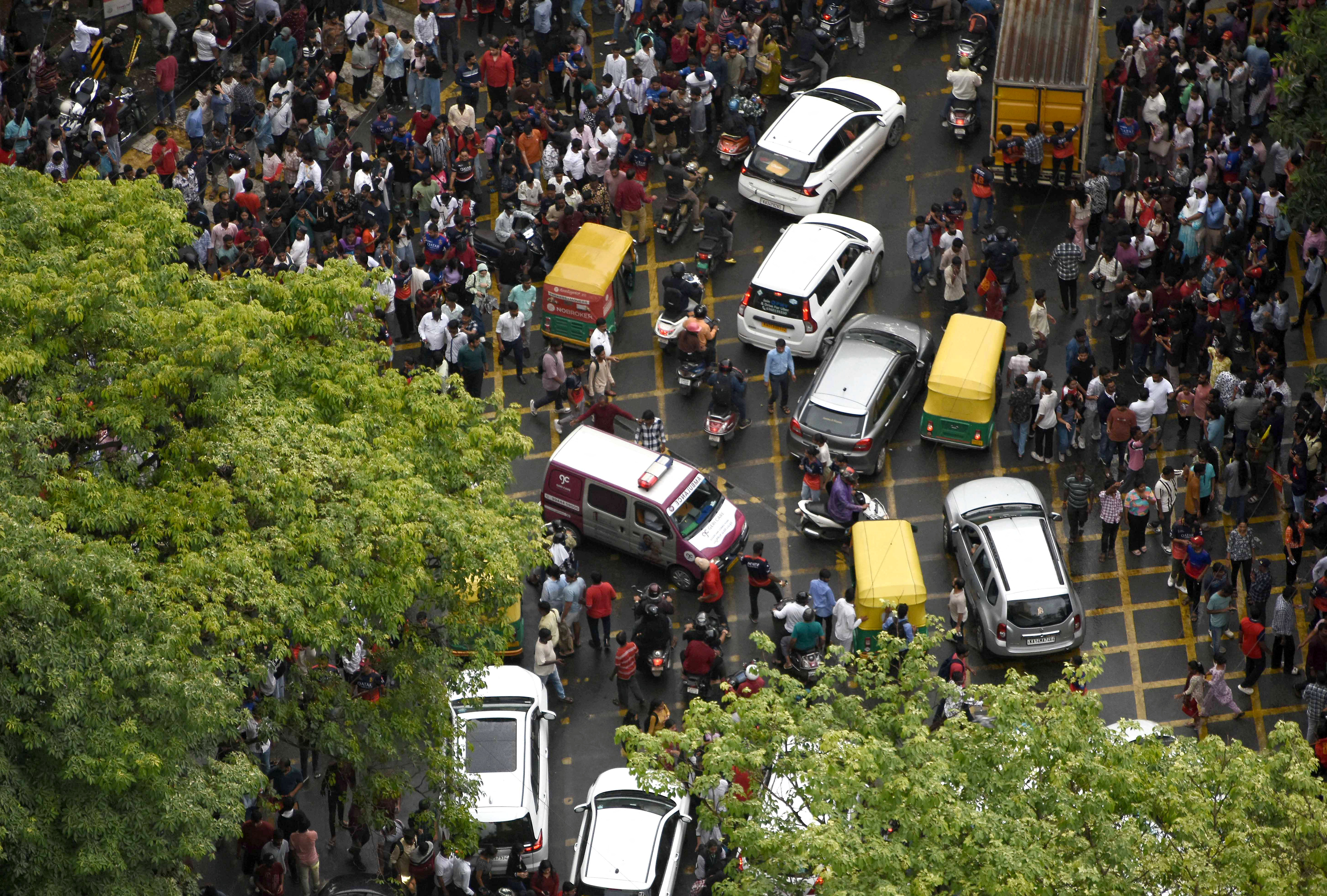 An ambulance moves following a stampede outside a cricket stadium in Bengaluru, India, June 4
