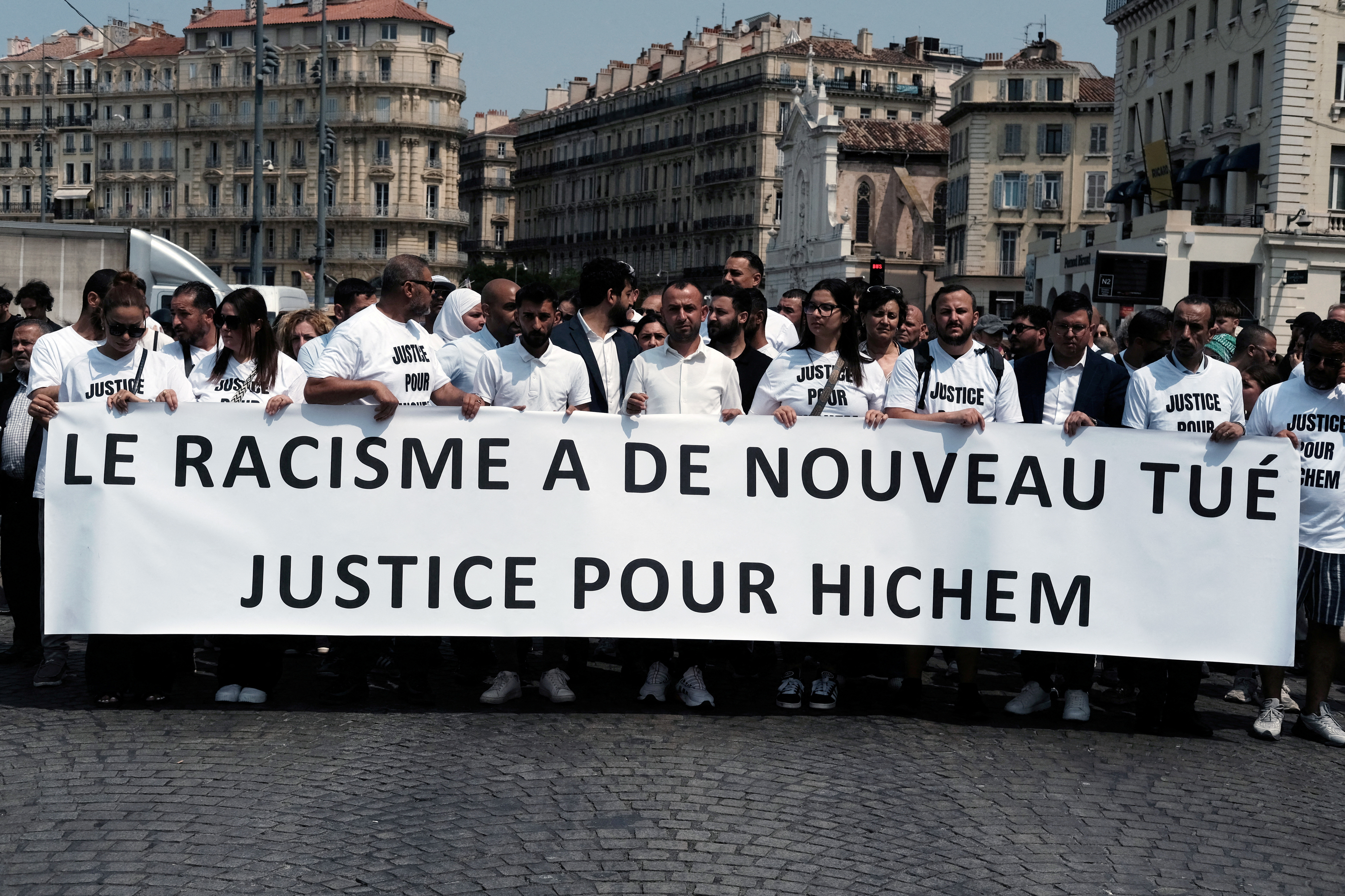 A banner which reads "Racism has killed once again" is displayed during a memorial march for Hichem Miraoui, a Tunisian man shot dead by his neighbour in Puget-sur-Argens, who is charged with "racially motivated assassination" as part of "a terrorist undertaking", in Marseille, France, June 8, 2025. REUTERS/Layli Foroudi