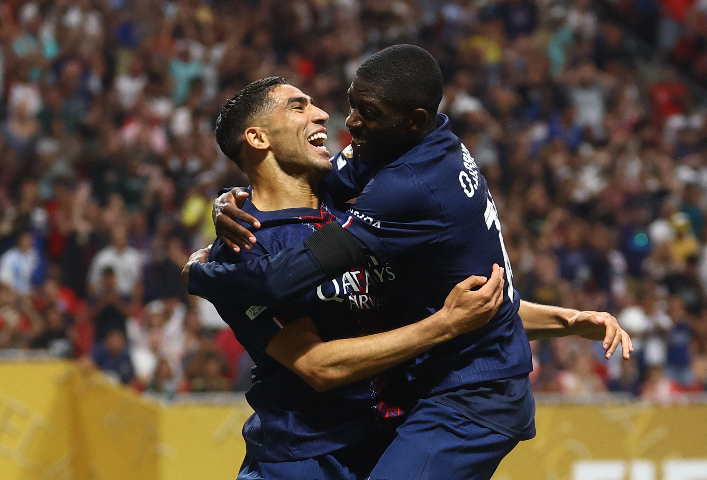 Paris St Germain's Ousmane Dembele celebrates scoring their second goal with Achraf Hakimi