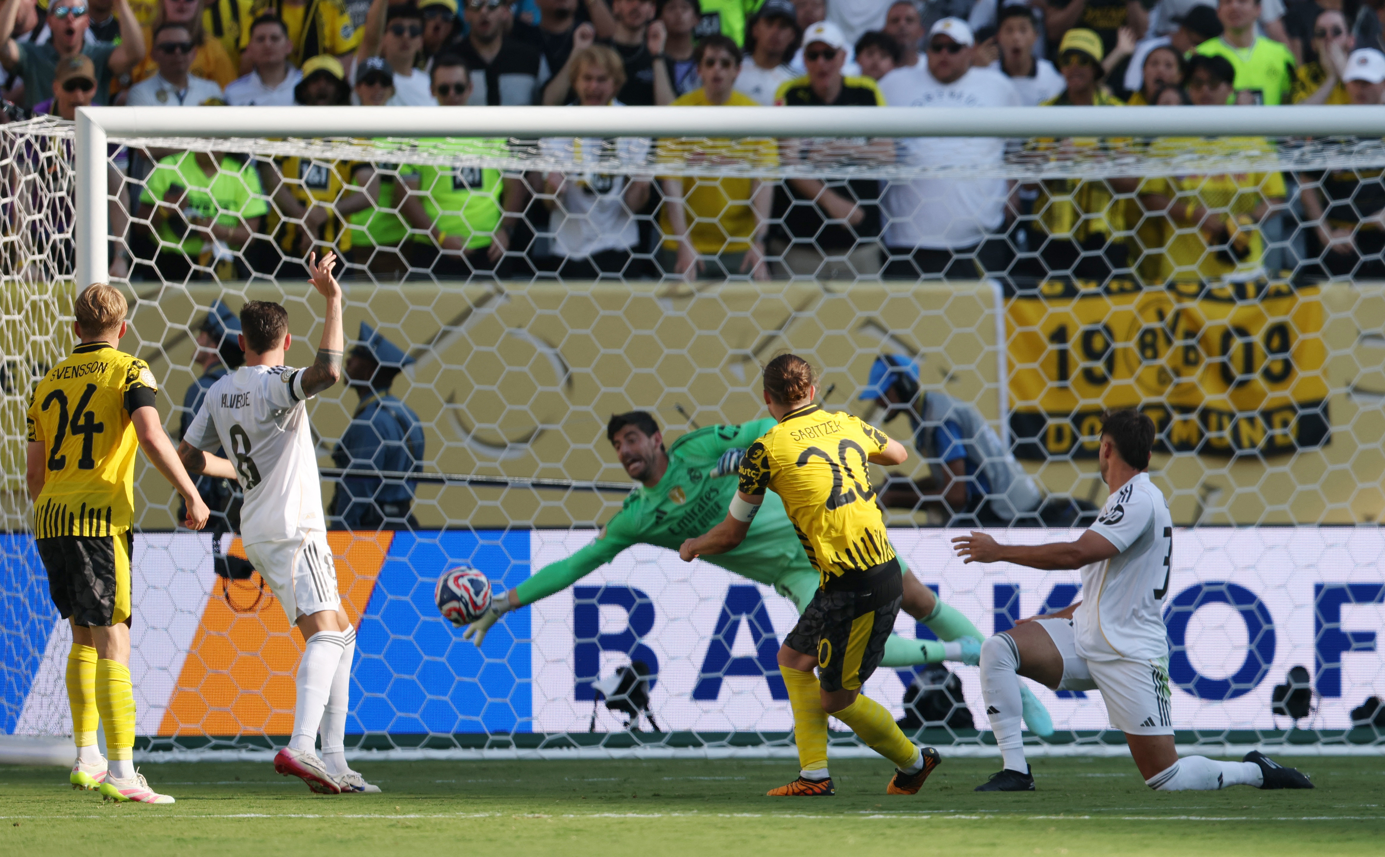 Real Madrid's Thibaut Courtois saves a shot from Borussia Dortmund's Marcel Sabitze