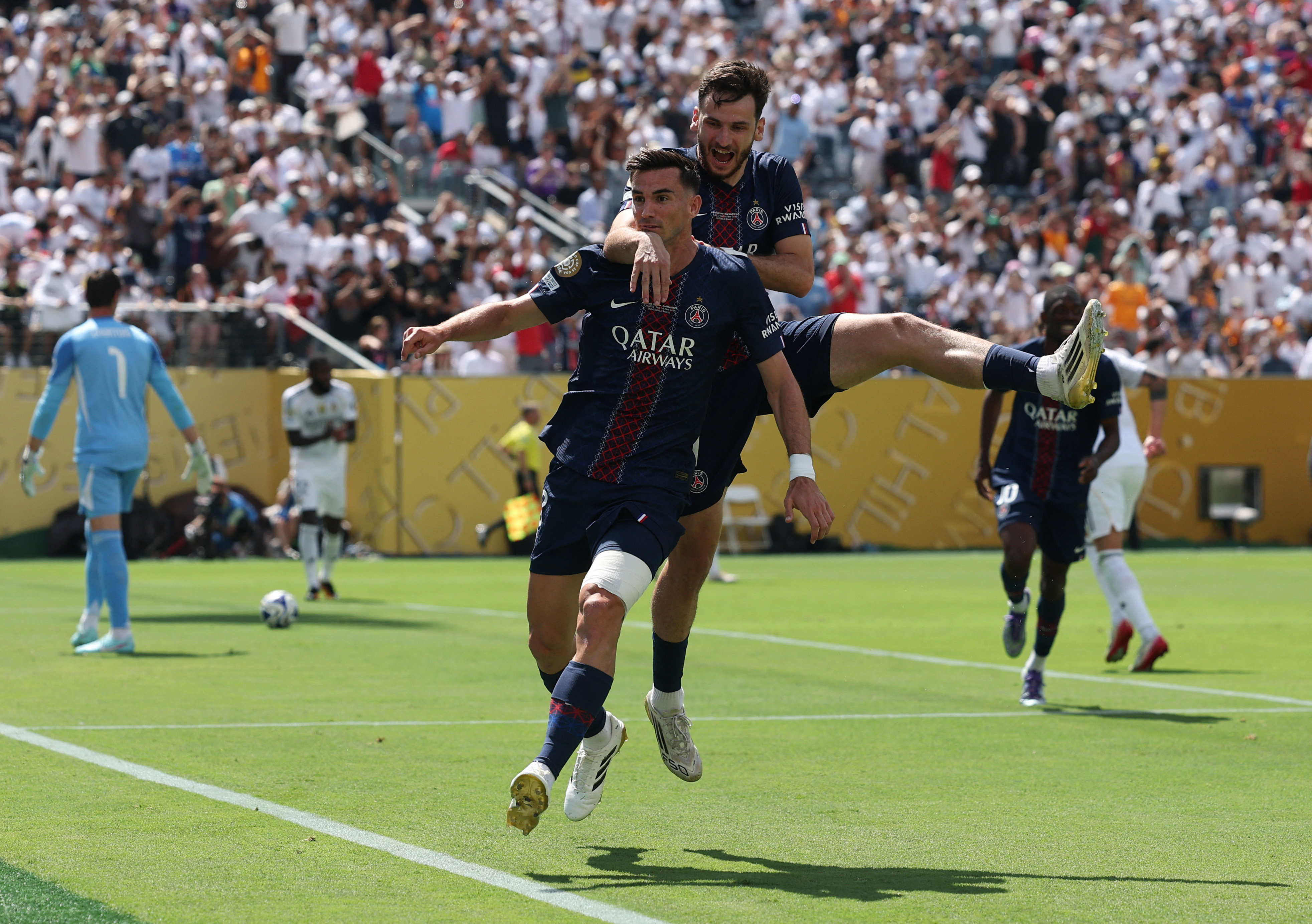 FIFA Club World Cup - Semi Final - Paris St Germain v Real Madrid - MetLife Stadium, East Rutherford, New Jersey, U.S. - July 9, 2025 Paris St Germain's Fabian Ruiz celebrates scoring their first goal with Khvicha Kvaratskhelia