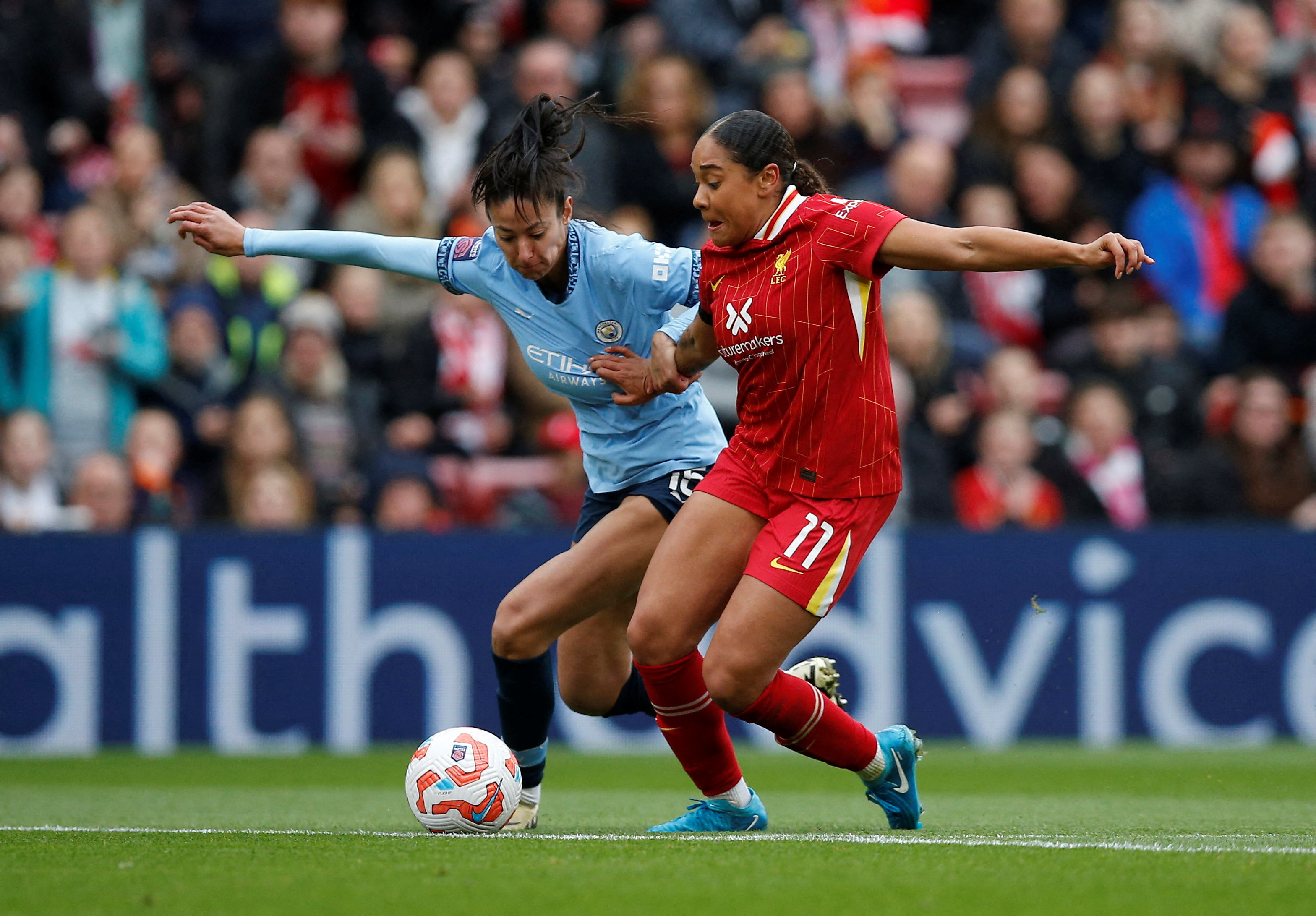 Liverpool's Olivia Smith in action with Manchester City's Leila Ouhabi