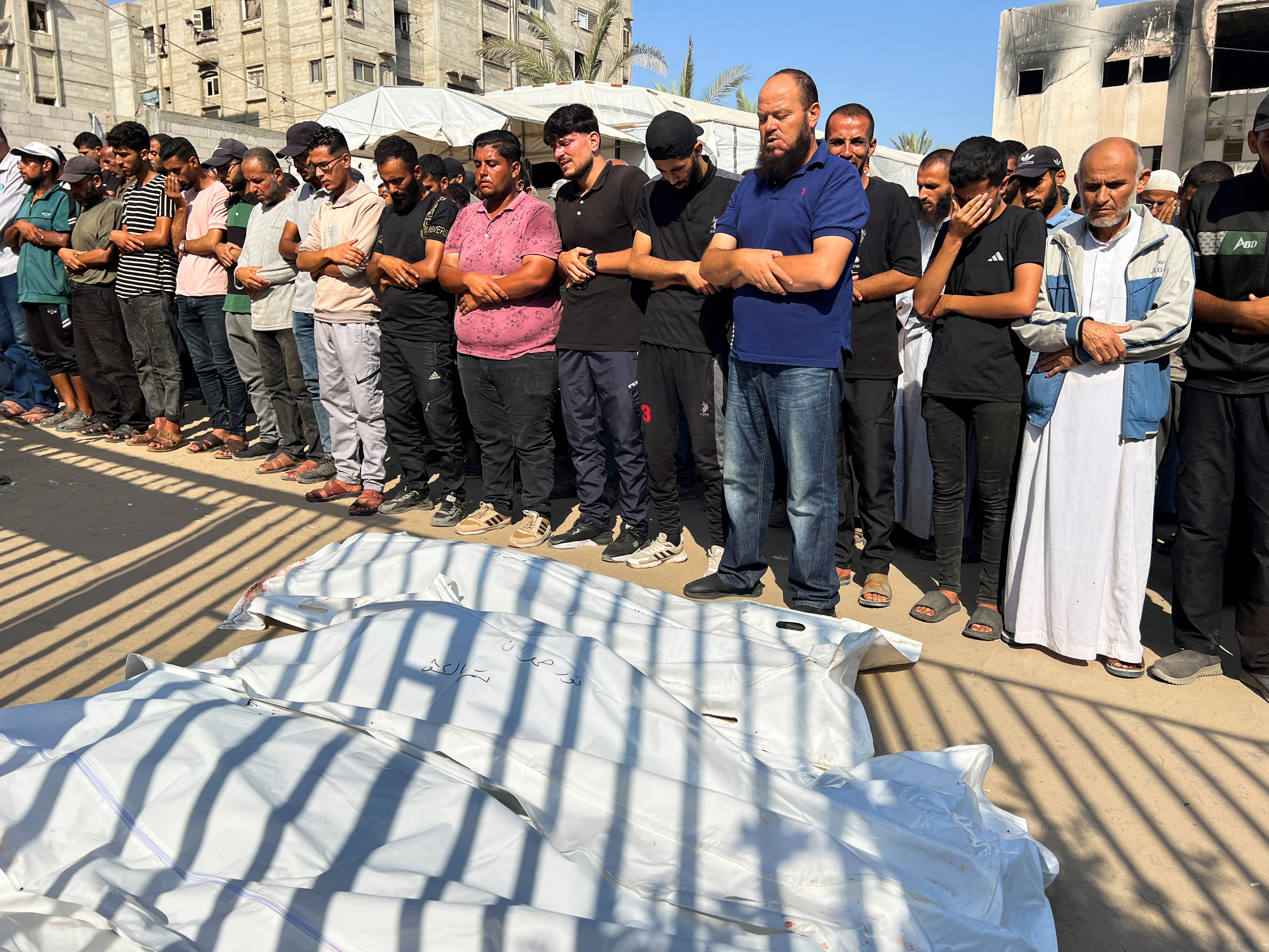 Palestinians mourn loved ones killed in Israeli attacks on Khan Younis, southern Gaza