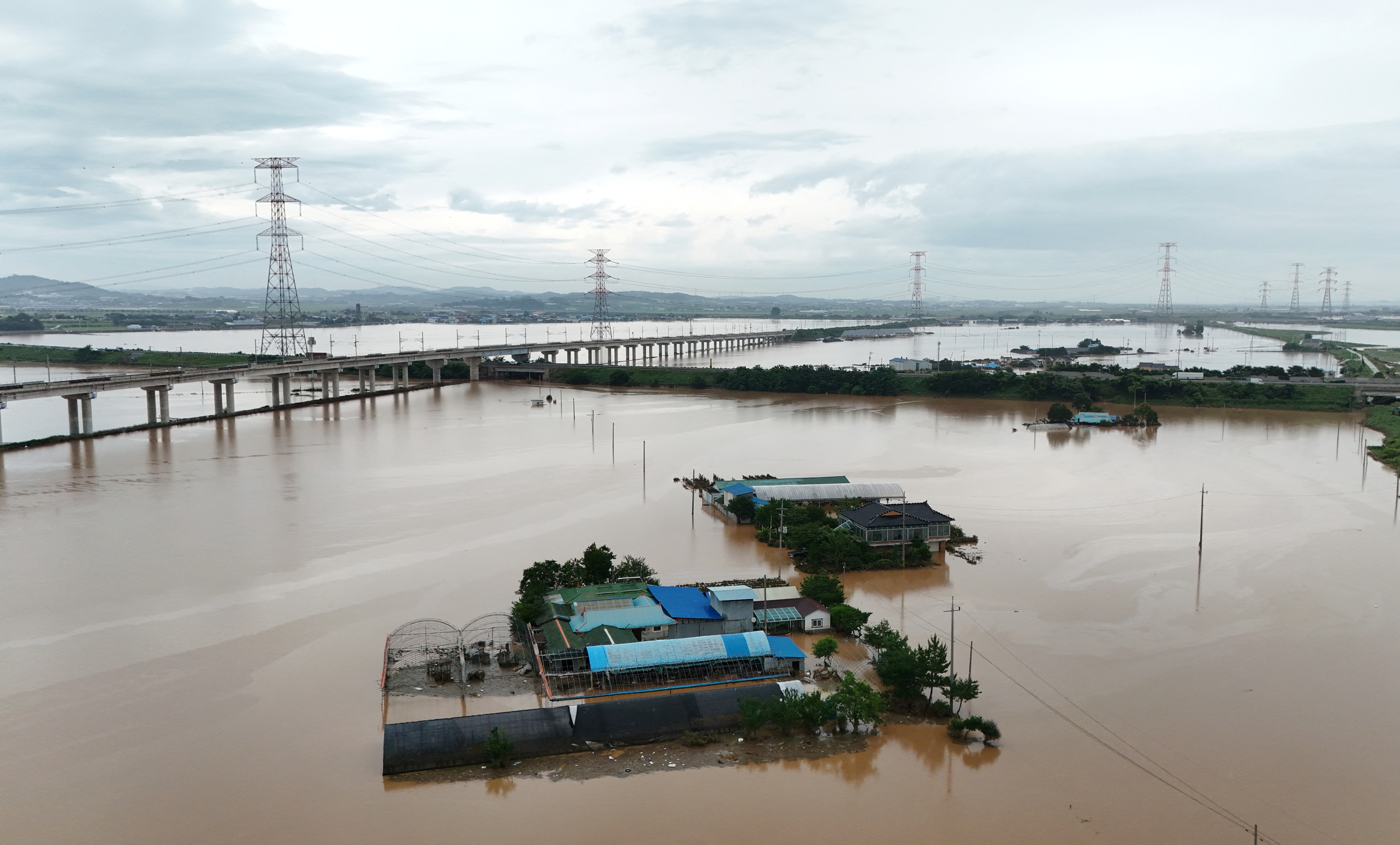 Houses are partially submerged during flooding caused by torrential rain, in Yesan, South Korea, July 18, 2025. REUTERS/Kim Hong-Ji