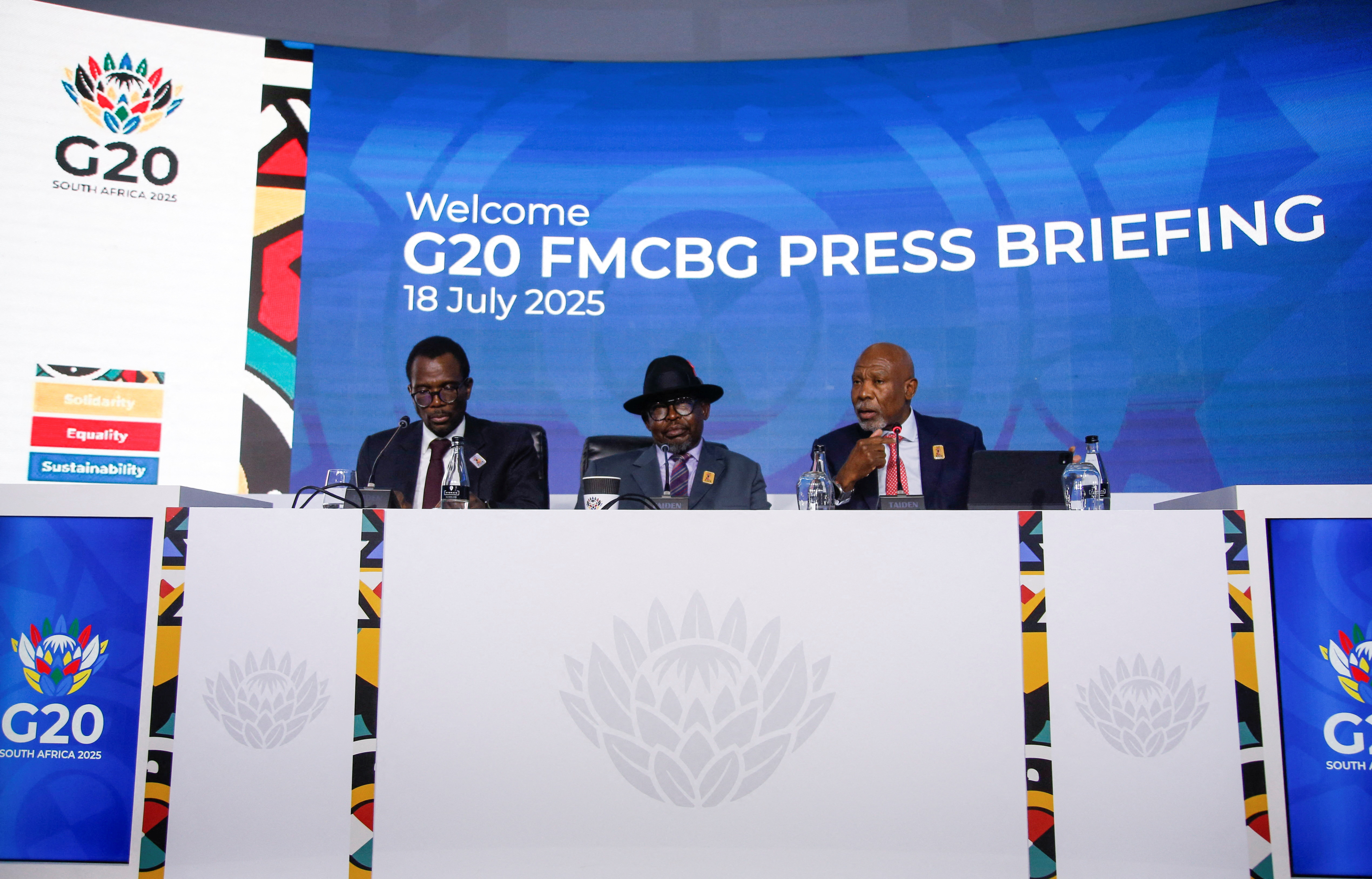 South Africa's Deputy Minister of Finance David Masondo, Minister of Finance Enoch Godongwana and Reserve Bank Governor Lesetja Kganyago