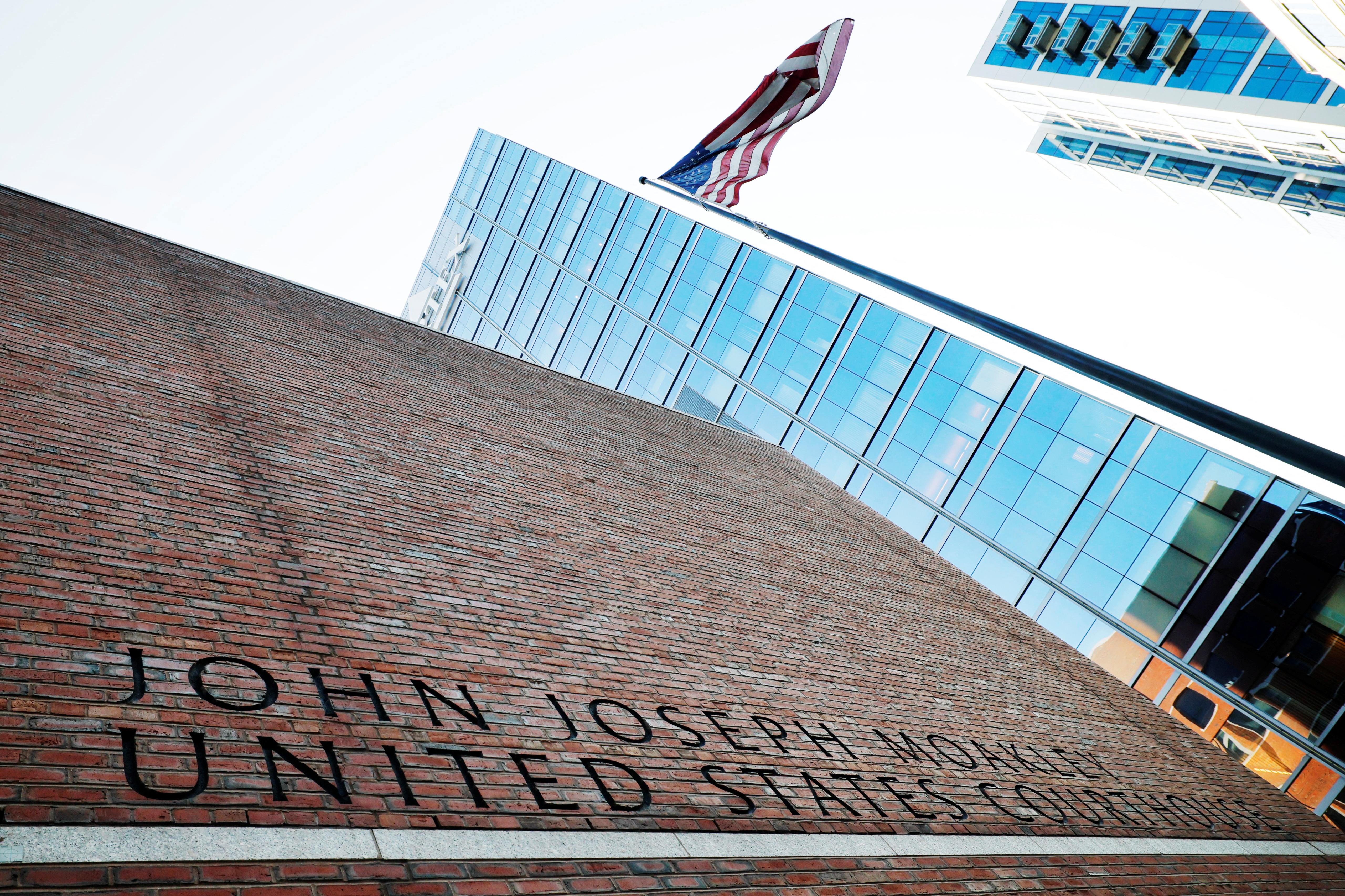 A US flag flies outside the federal courthouse where Harvard University is urging a federal judge to order US President Donald Trump's administration to restore more than 2 bn in canceled federal grants and cease efforts to cut off research funding, in Boston, Massachusetts, US, July 21, 2025. [Brian Snyder/Reuters]