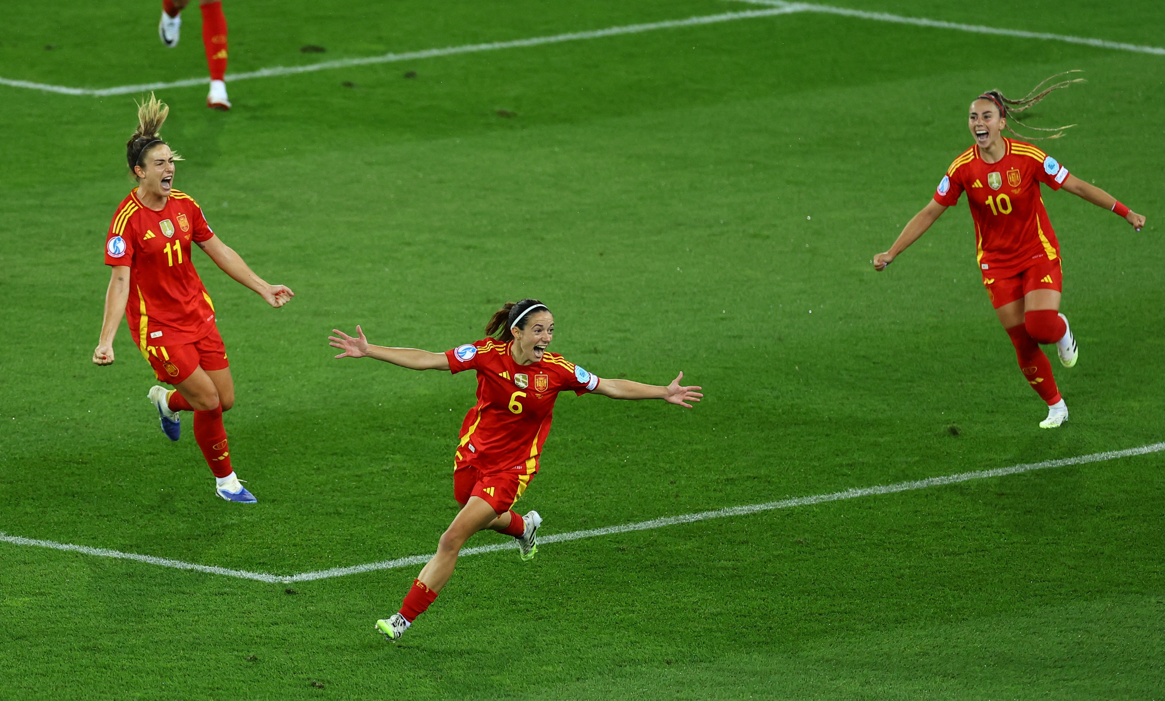Spain's Aitana Bonmati celebrates scoring their first goal against Germany with Alexia Putellas and Athenea del Castillo 