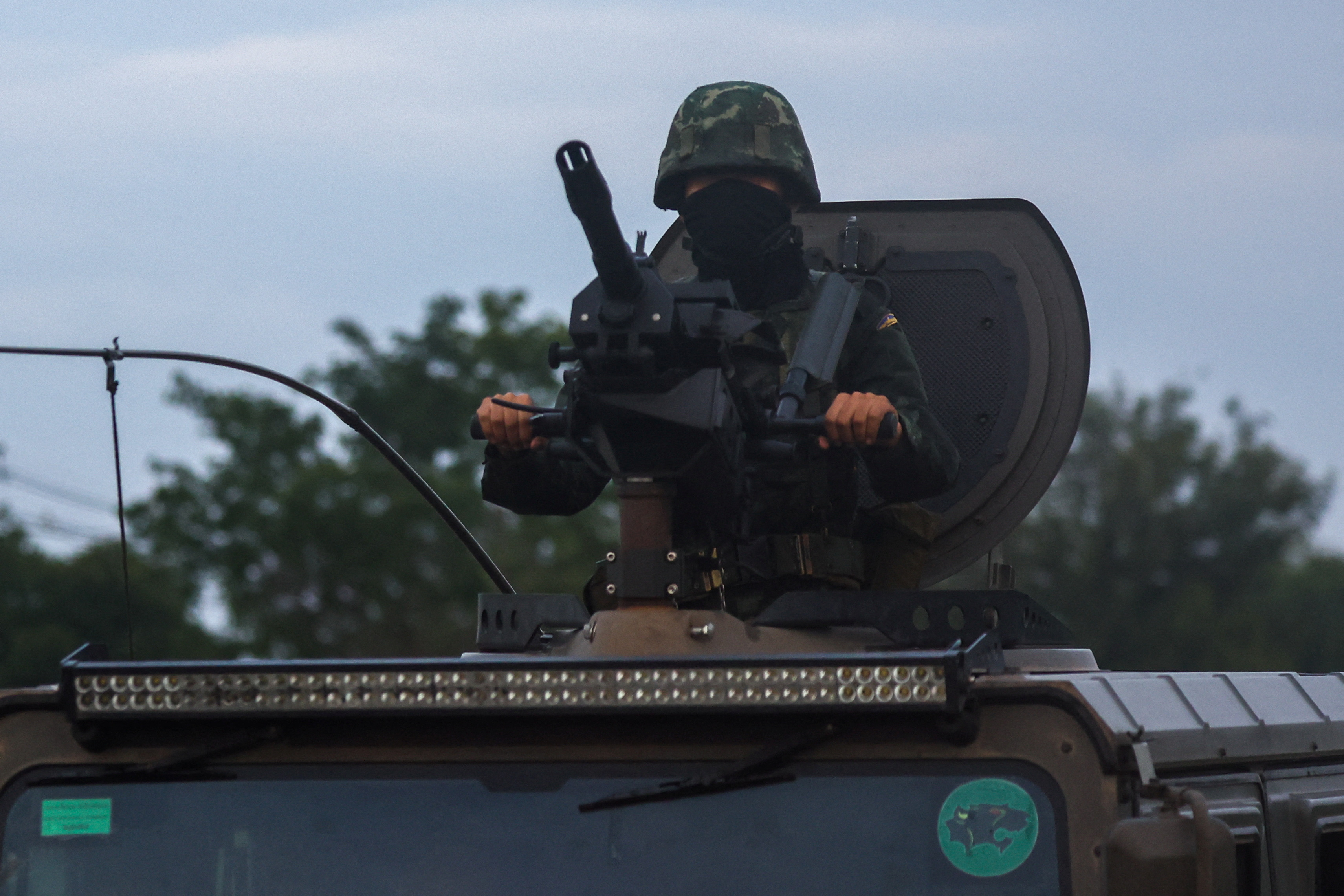A soldier rides a military vehicle in Buriram province. Thailand,