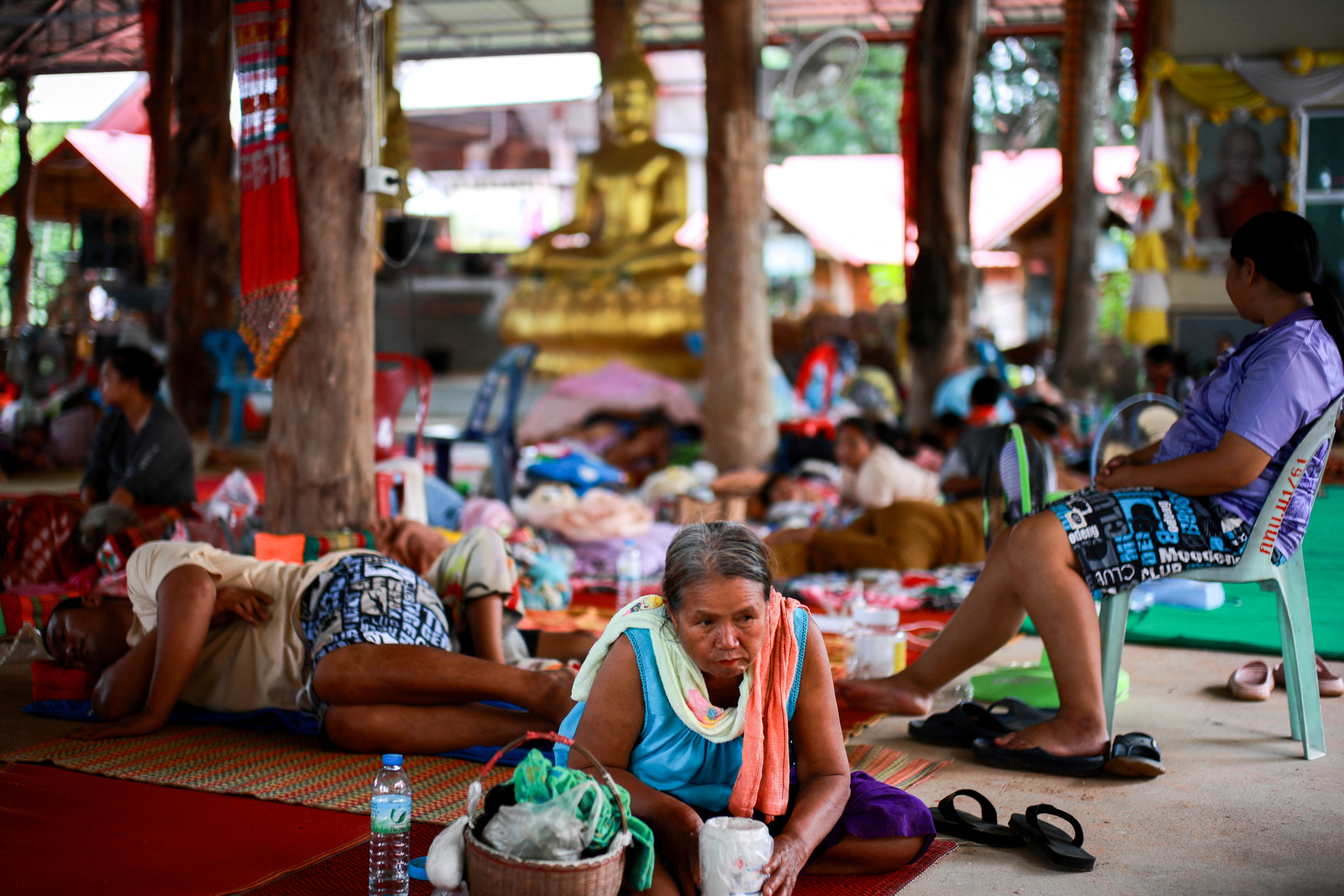 Displaced people rest inside a shelter in Sisaket province amid ongoing clashes on the Thai-Cambodian border that extended to a third day, with new flashpoints emerging as both sides seek diplomatic support and urge for negotiations, Thailand, July 26, 2025. REUTERS/Athit Perawongmetha