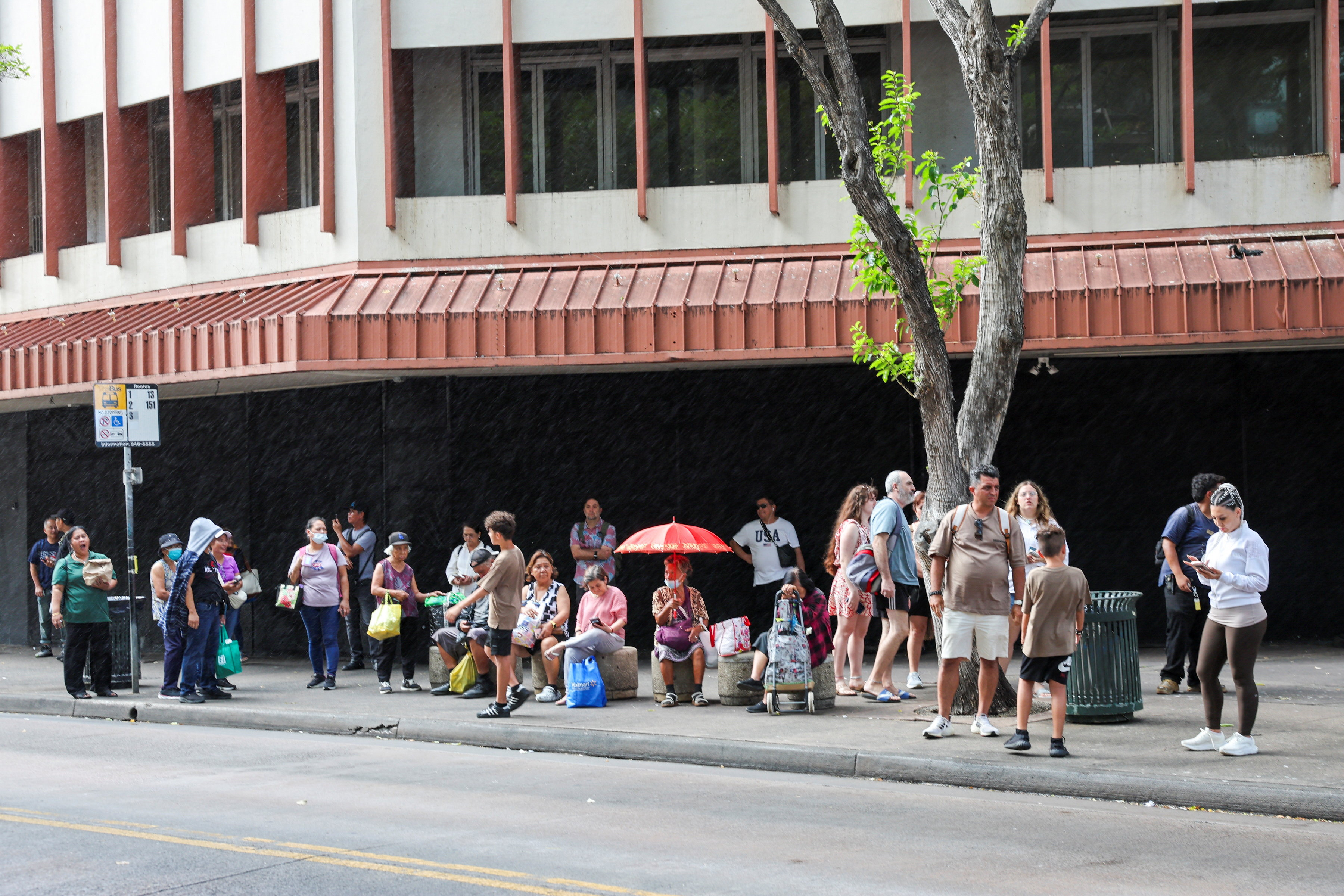 With traffic jams across Oahu, bus riders wait for their buses after authorities warned residents of the possibility of destructive tsunami waves, following an earthquake which earlier struck off Russia's Far Eastern Kamchatka Peninsula, in Honolulu, Hawaii, U.S. July 29, 2025. REUTERS/Marco Garcia