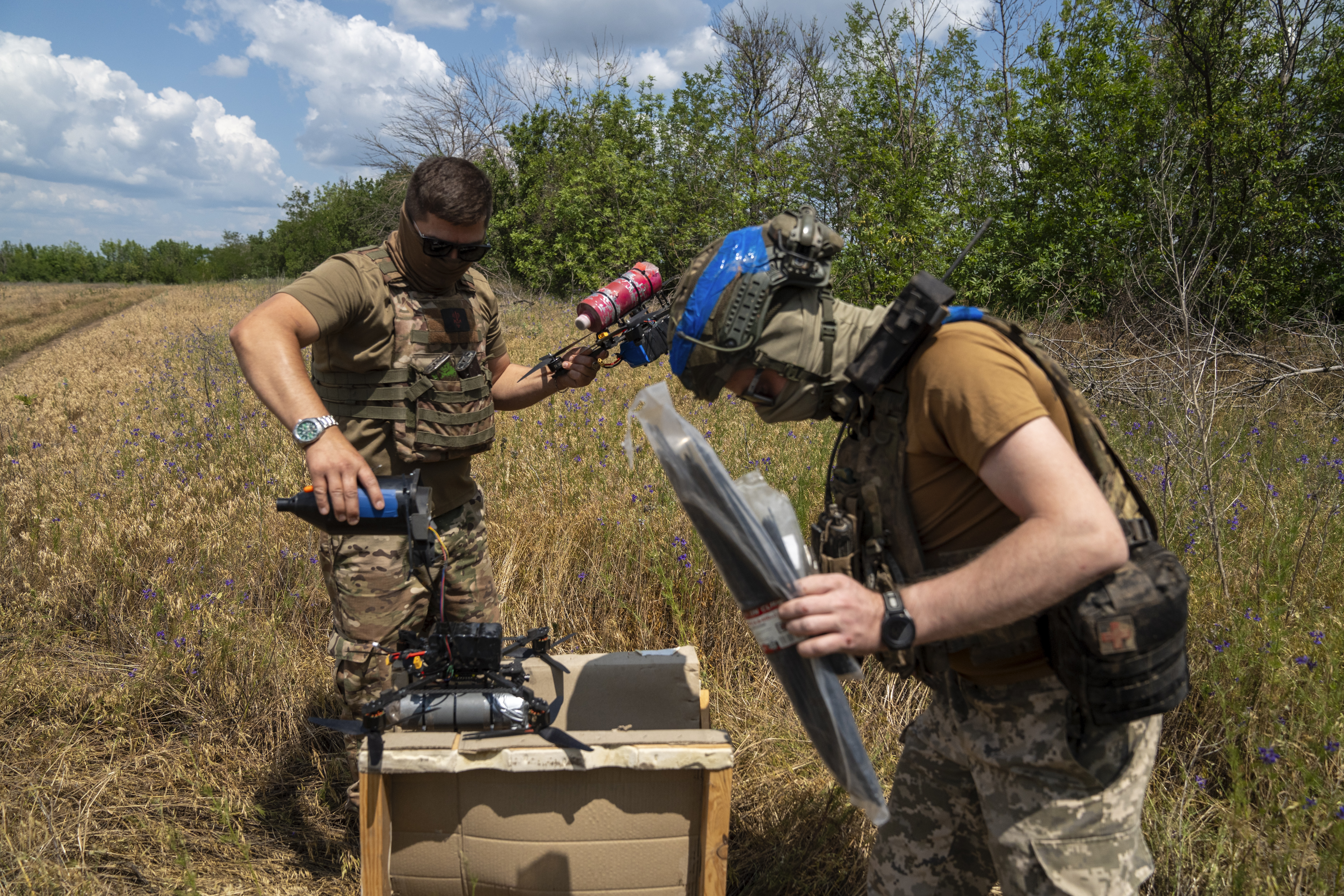Ukrainian soldiers test drones before heading to the front lines in Donetsk