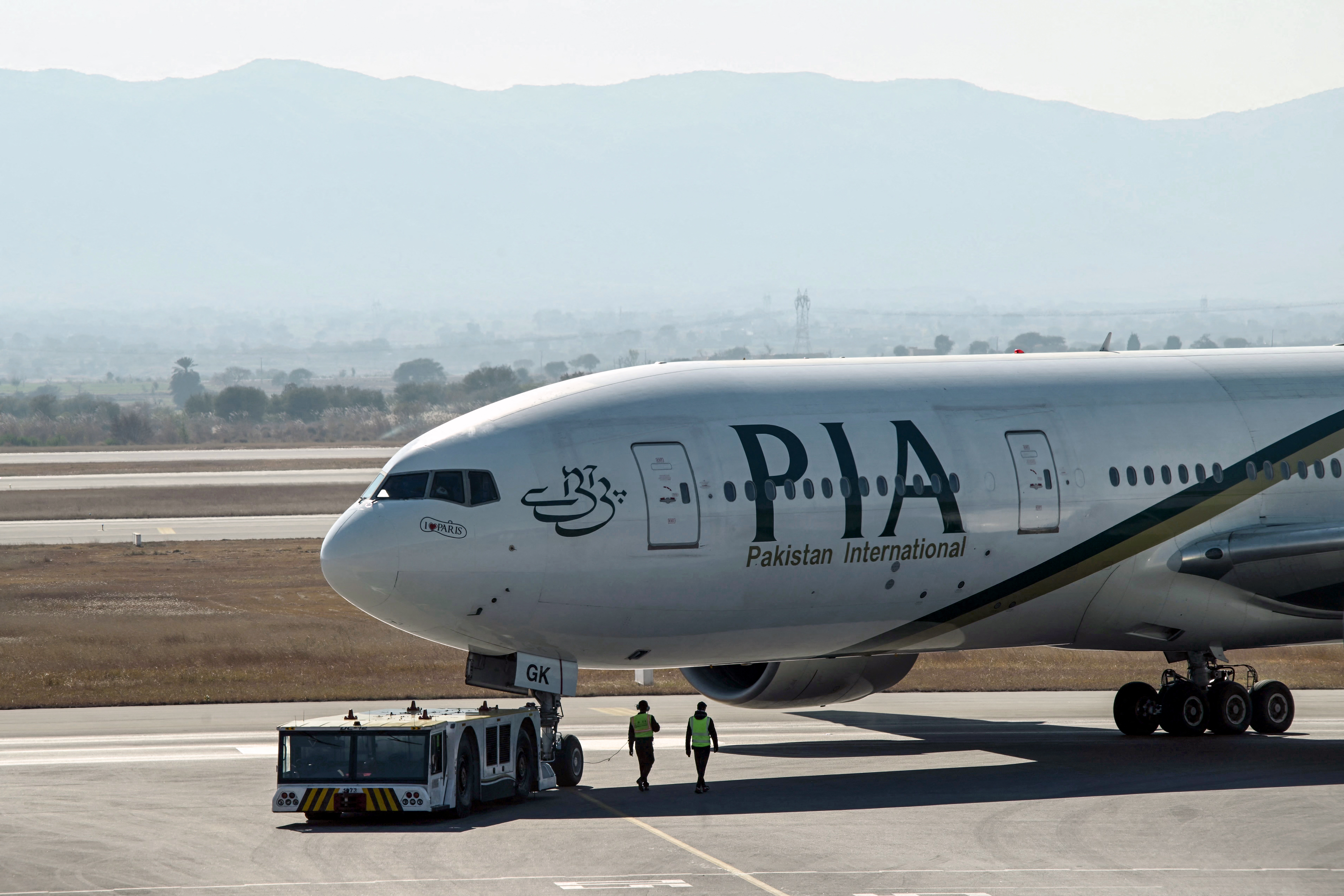 Pakistan International Airline (PIA) aircraft taxis ahead of its takeoff for France at Islamabad International Airport on January 10, 2025.