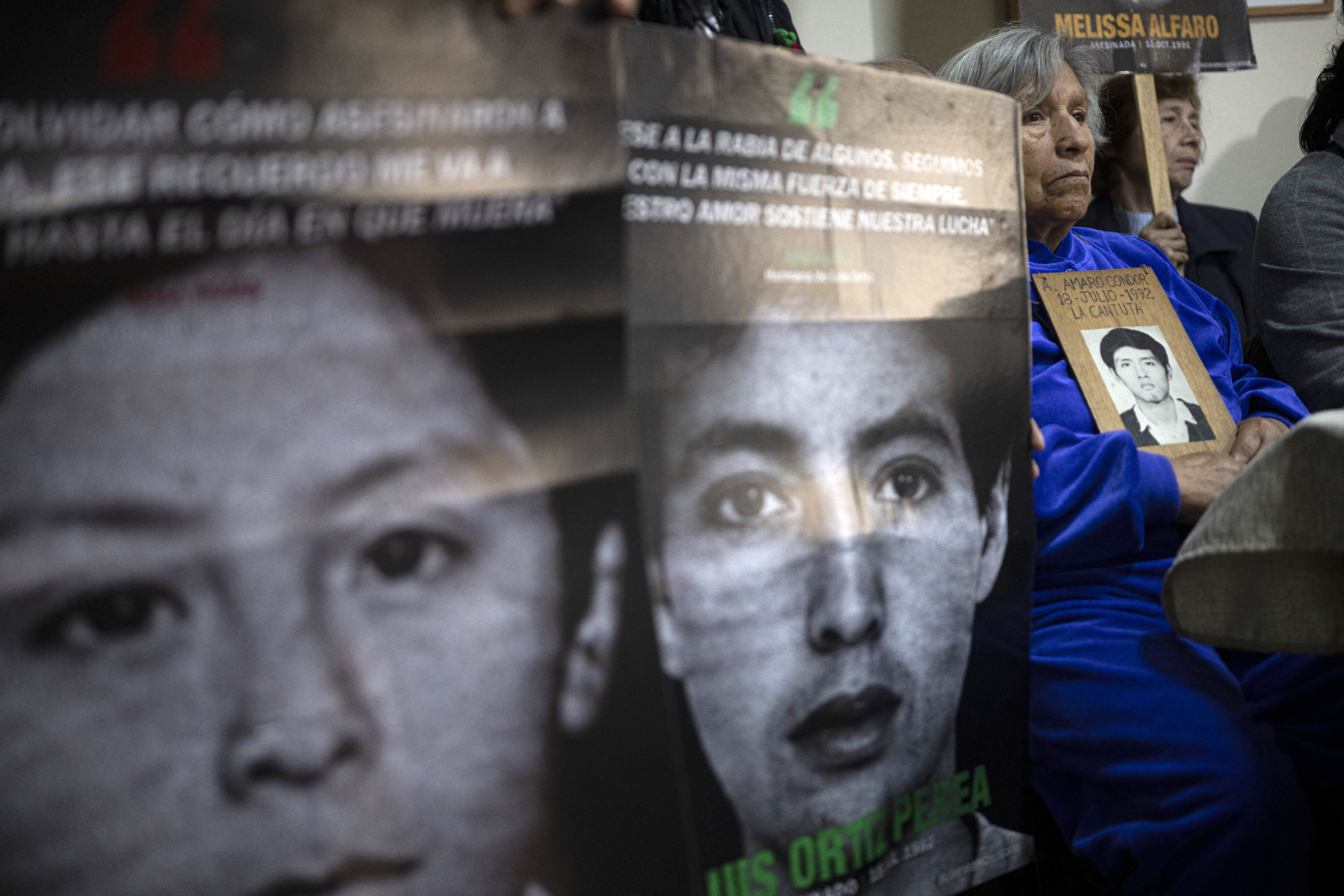 Raida Condor (R), mother of Amaro Condor, one of five students killed by a military squad during a raid at a university campus in 1992, accompanies relatives of victims of the armed conflict in Peru and members of human rights organisations to speak out.