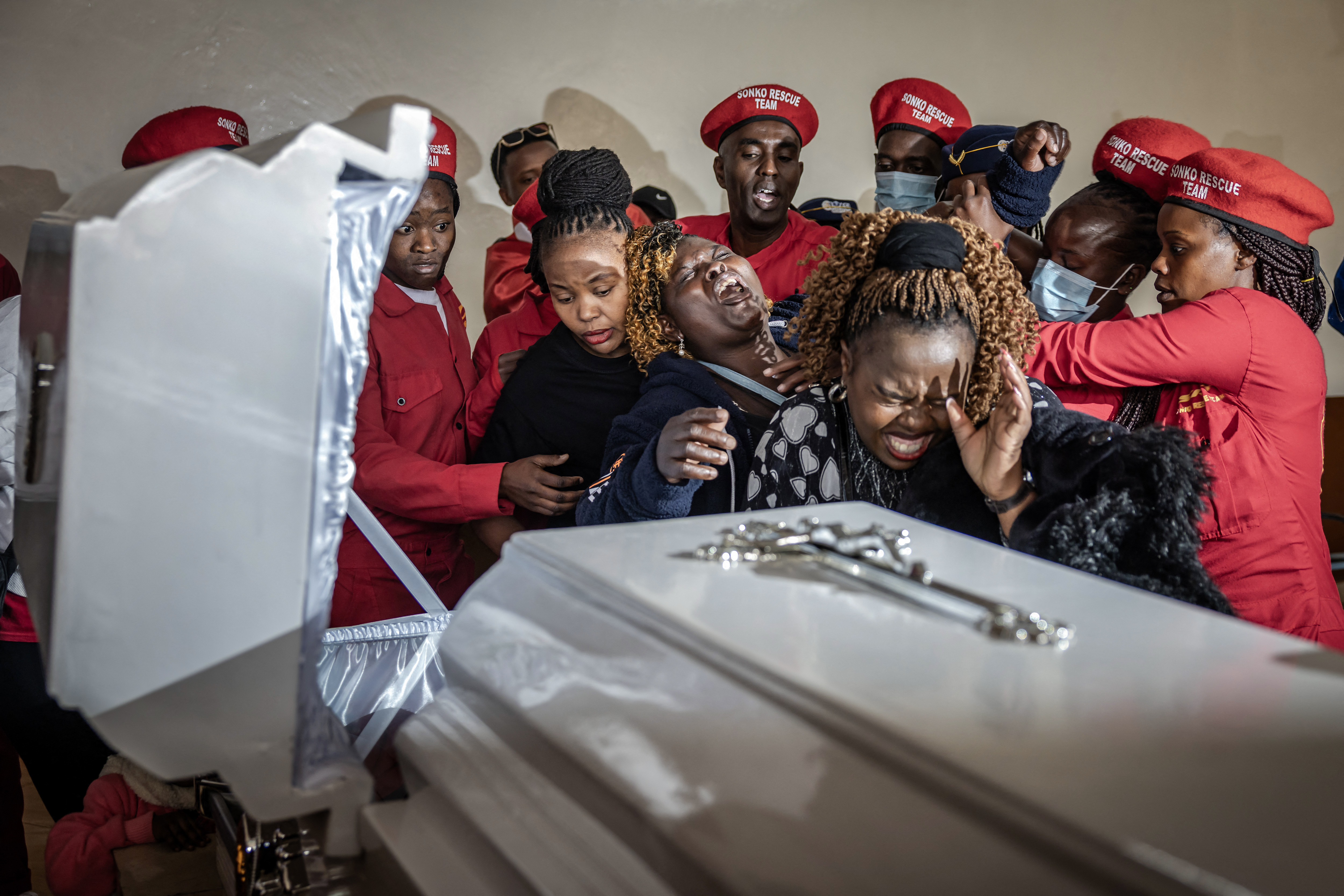 Susan Njeri, centre, mother of Boniface Kariuki,