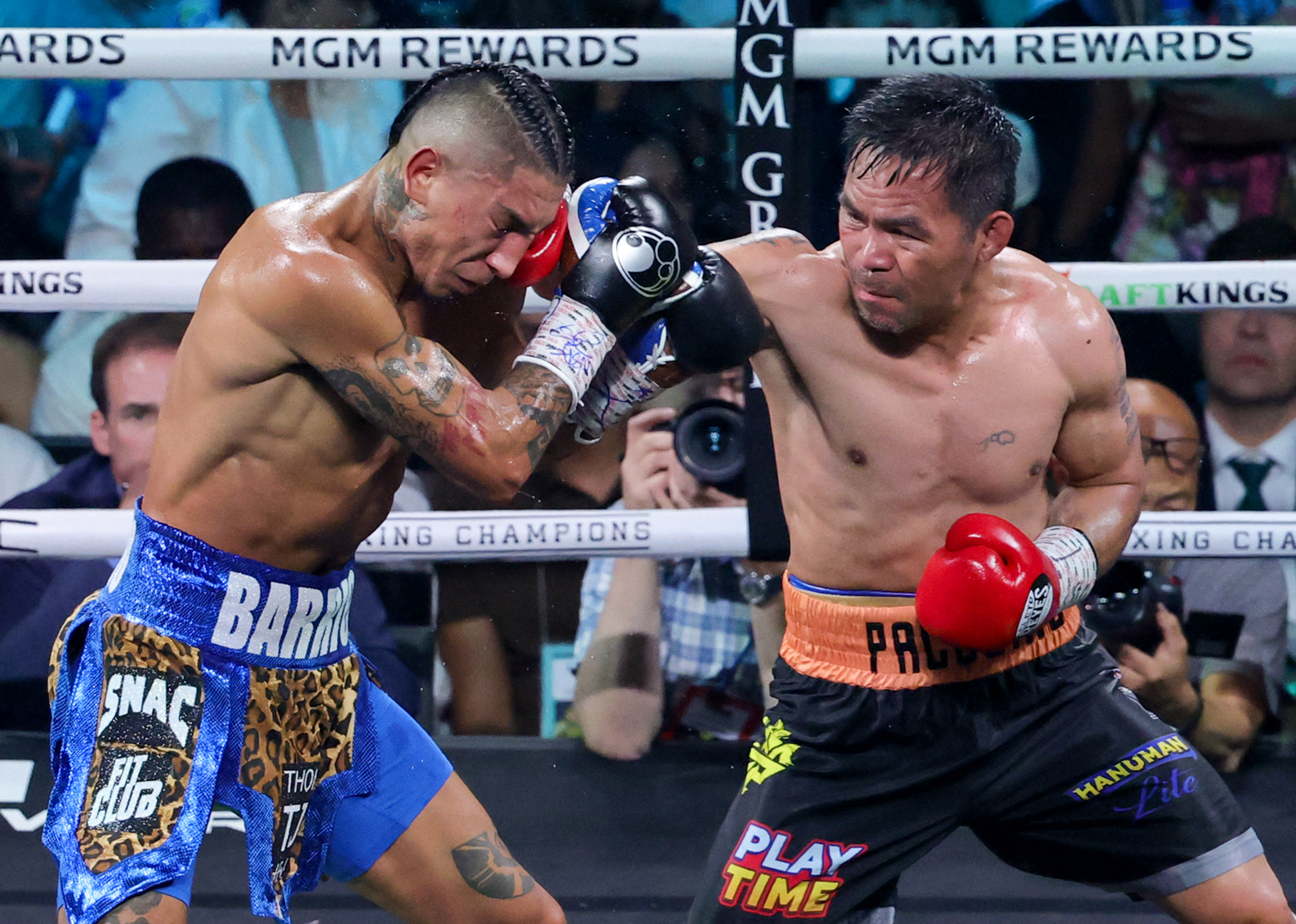 Mario Barrios and Manny Pacquiao in action.