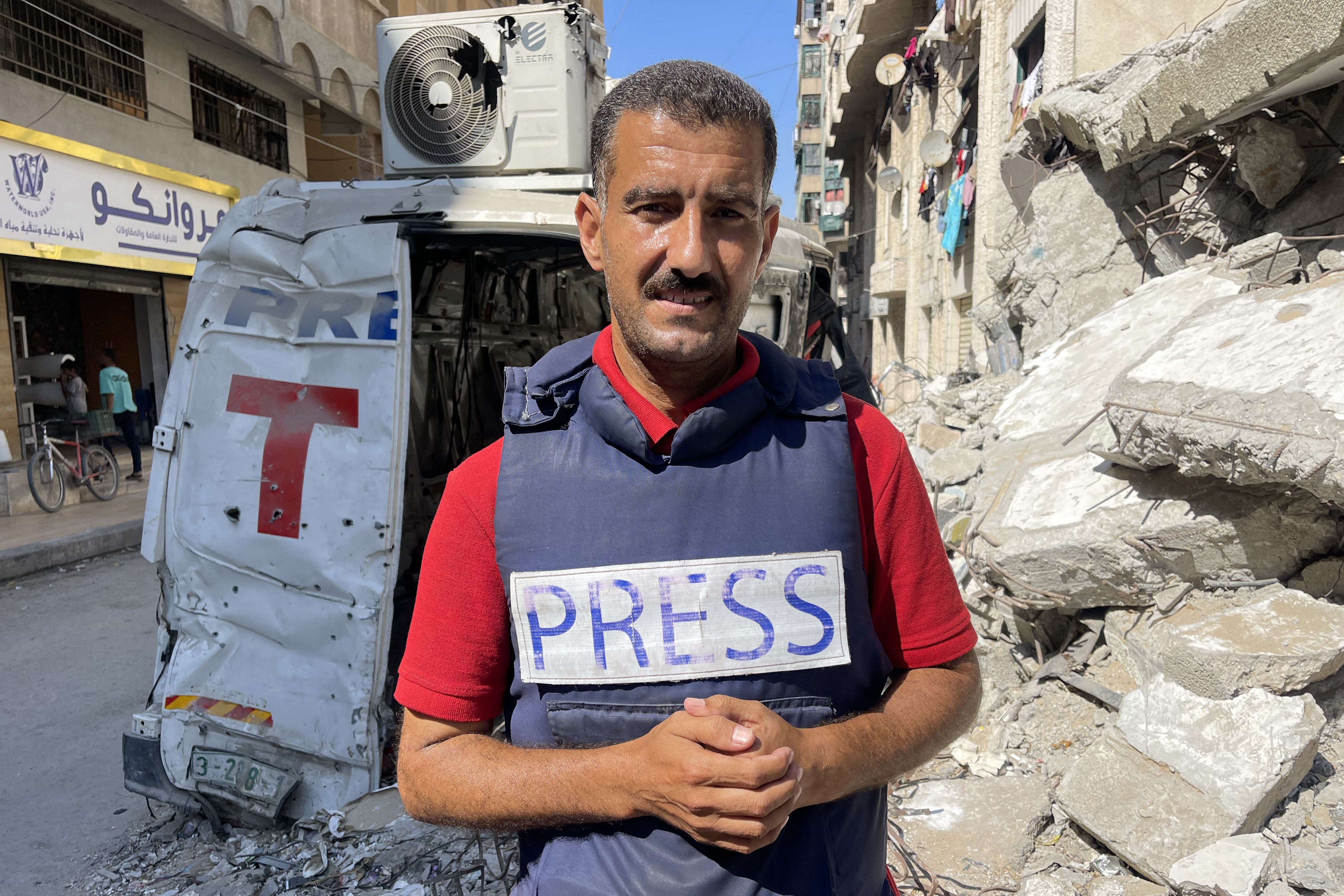 AFP journalist Khader Zaanoun poses for a picture in Gaza City