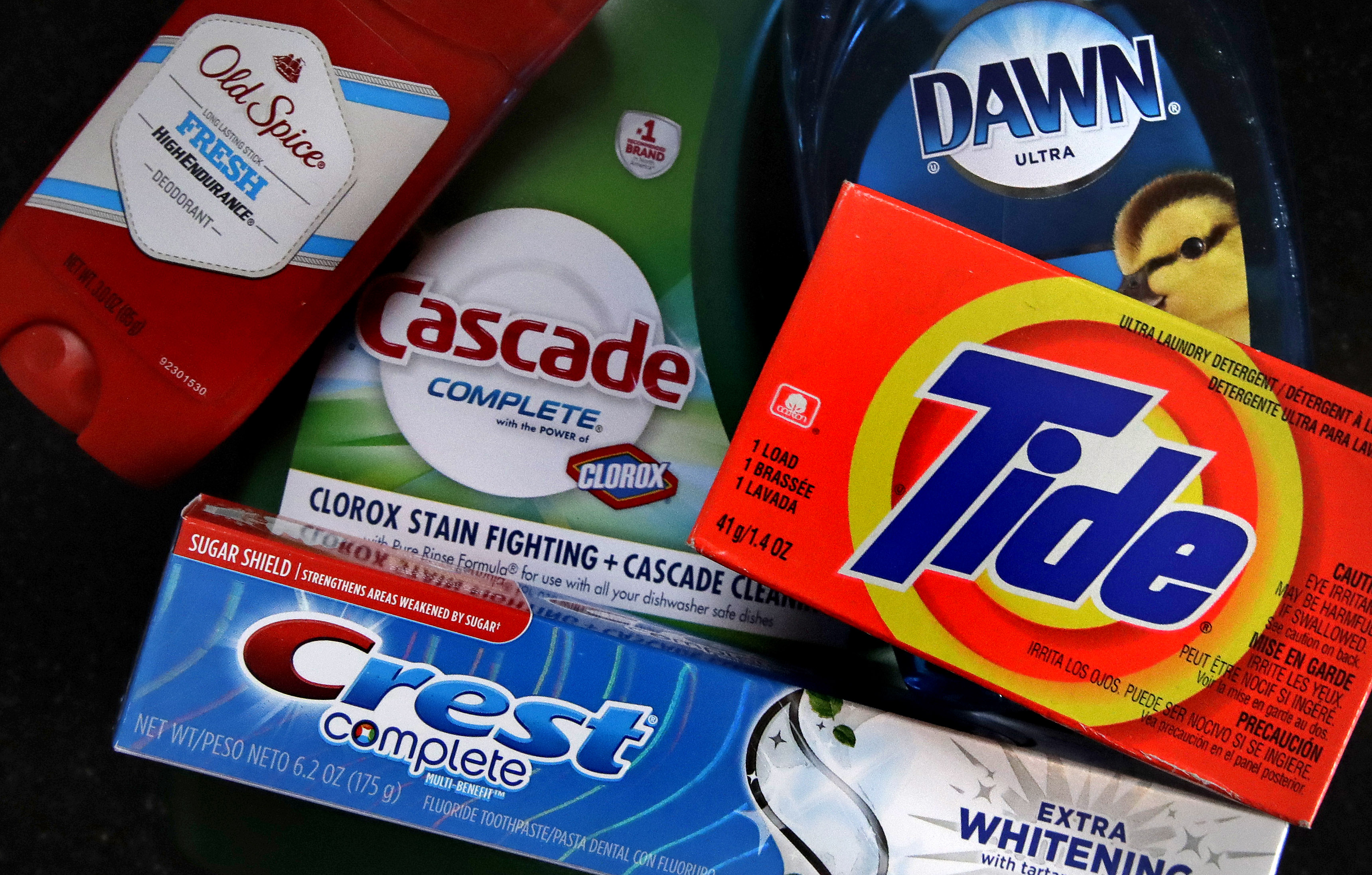 FILE- In this June 15, 2018, file photo a variety of Procter & Gamble products rest on a counter in East Derry, N.H. Procter & Gamble Co., raised its full-year sales outlook though it cautioned that higher commodity prices continue to squeeze profits.(AP Photo/Charles Krupa, File)