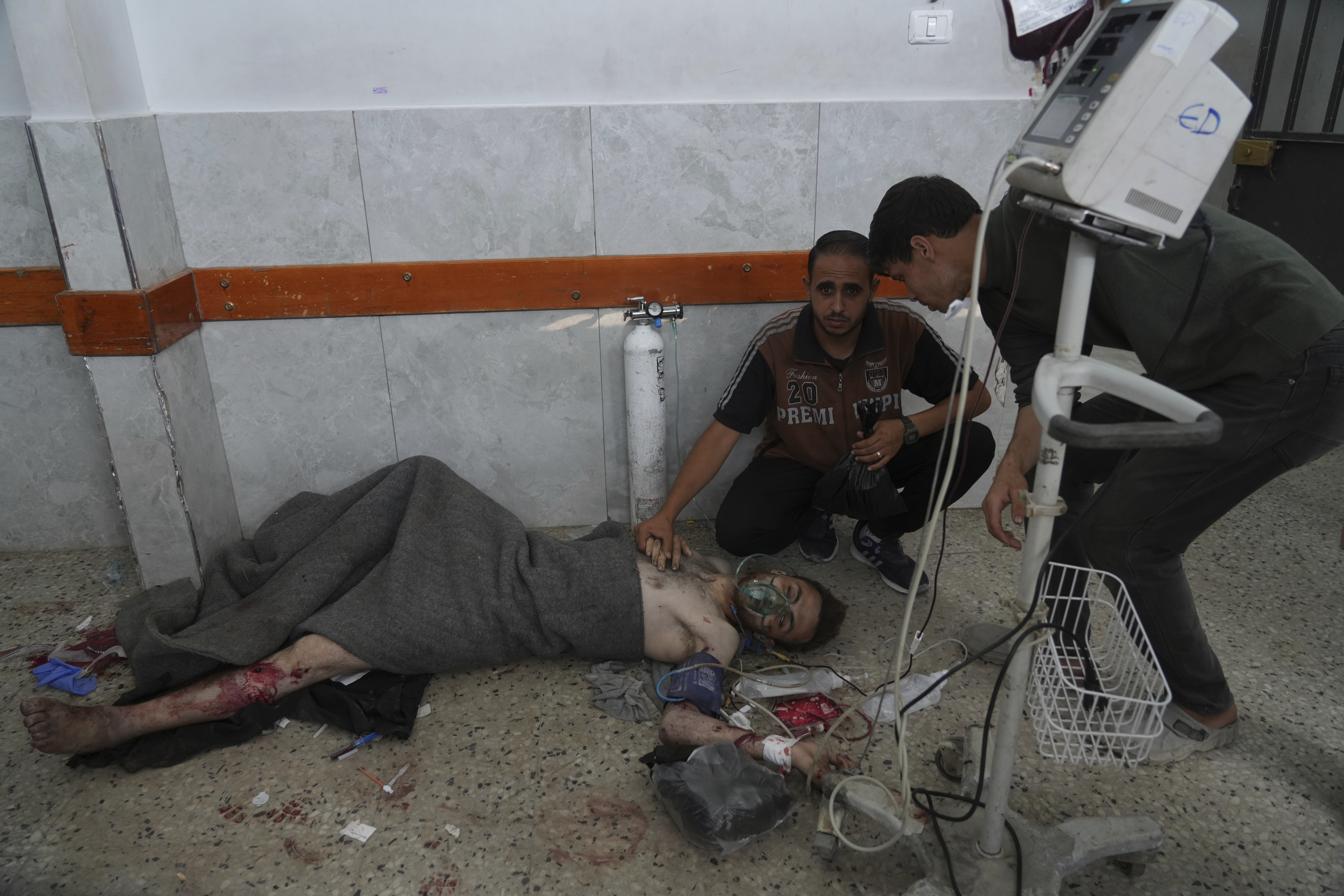 A Palestinian wounded in an Israeli strike is treated in the Shifa Hospital