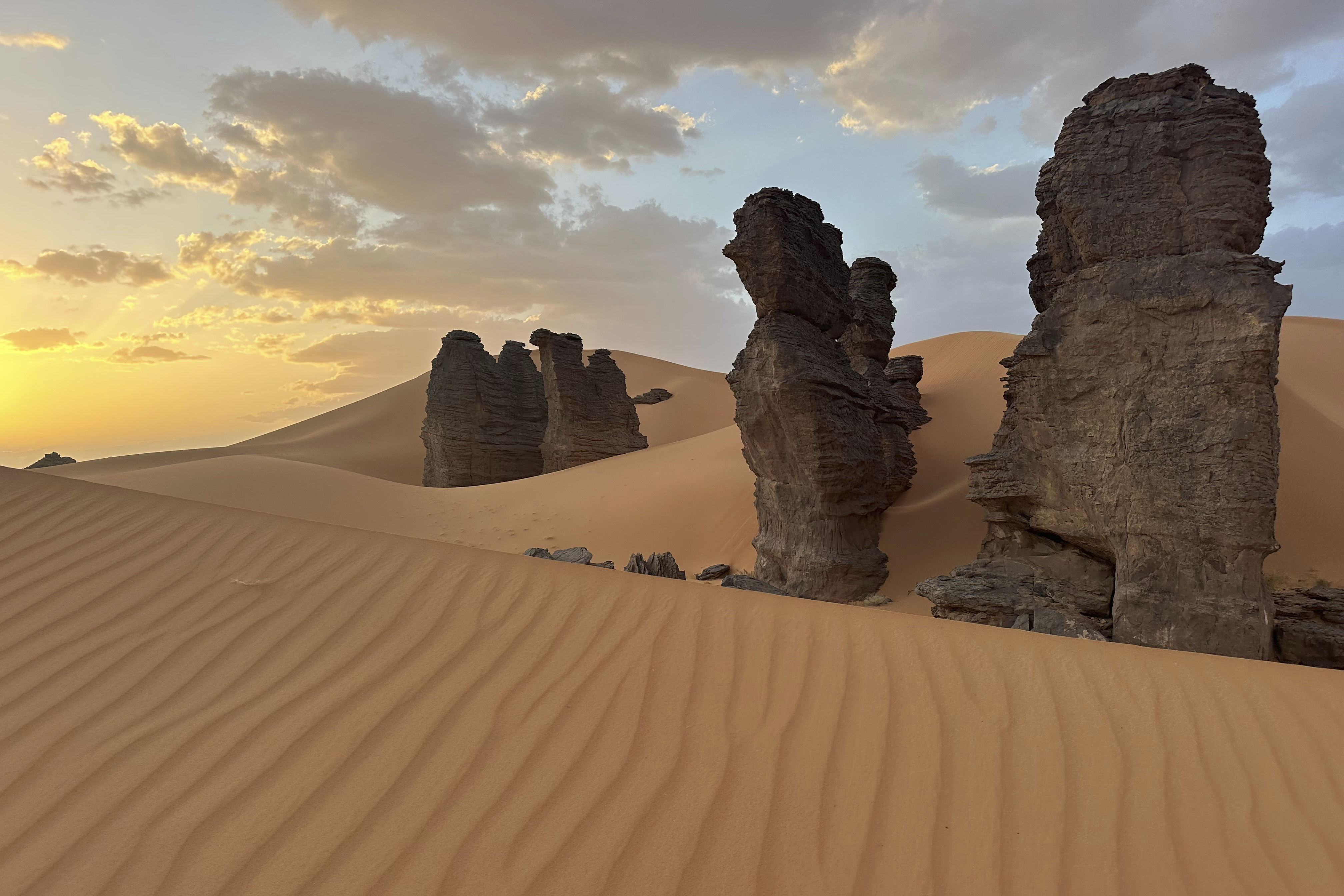 Rock formations stand in the Sahara desert outside the city center of Djanet, a southeastern Algerian oasis town in the Sahara desert,