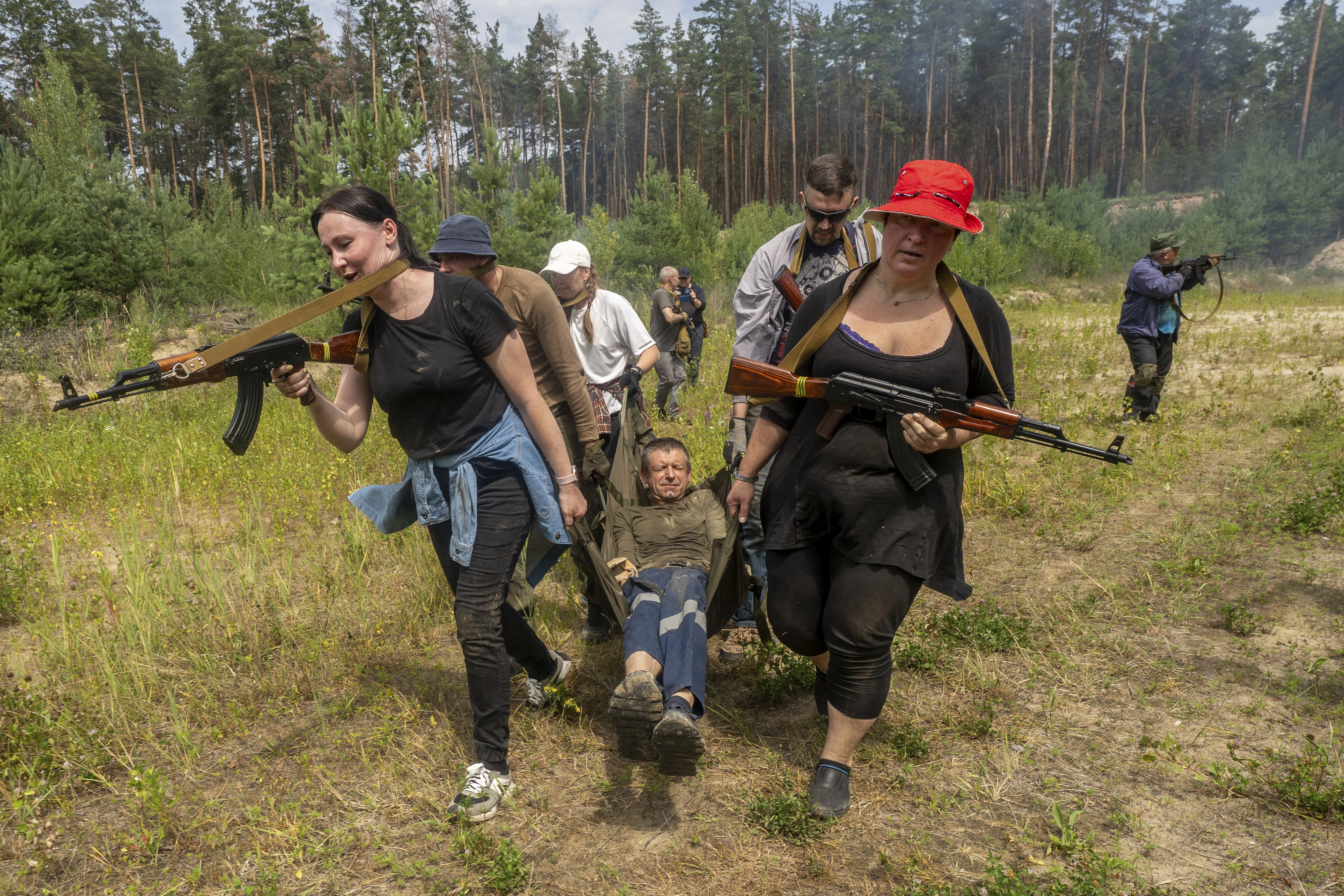 Civilians practice military skills on a training ground in Kharkiv, Ukraine, Saturday, July 12, 2025.
