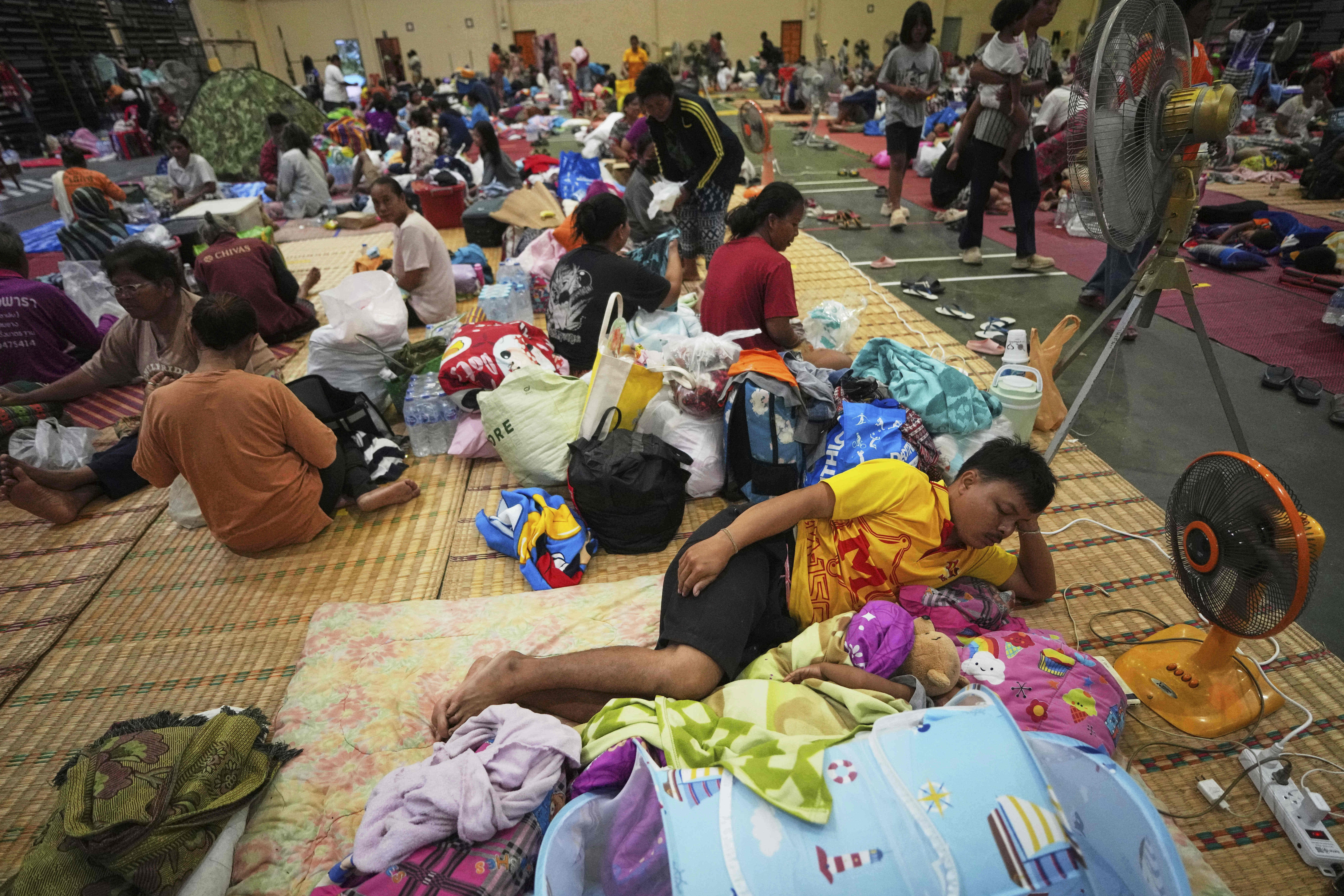 Thai-Cambodian clashes force 100,000 into shelters on Thai border