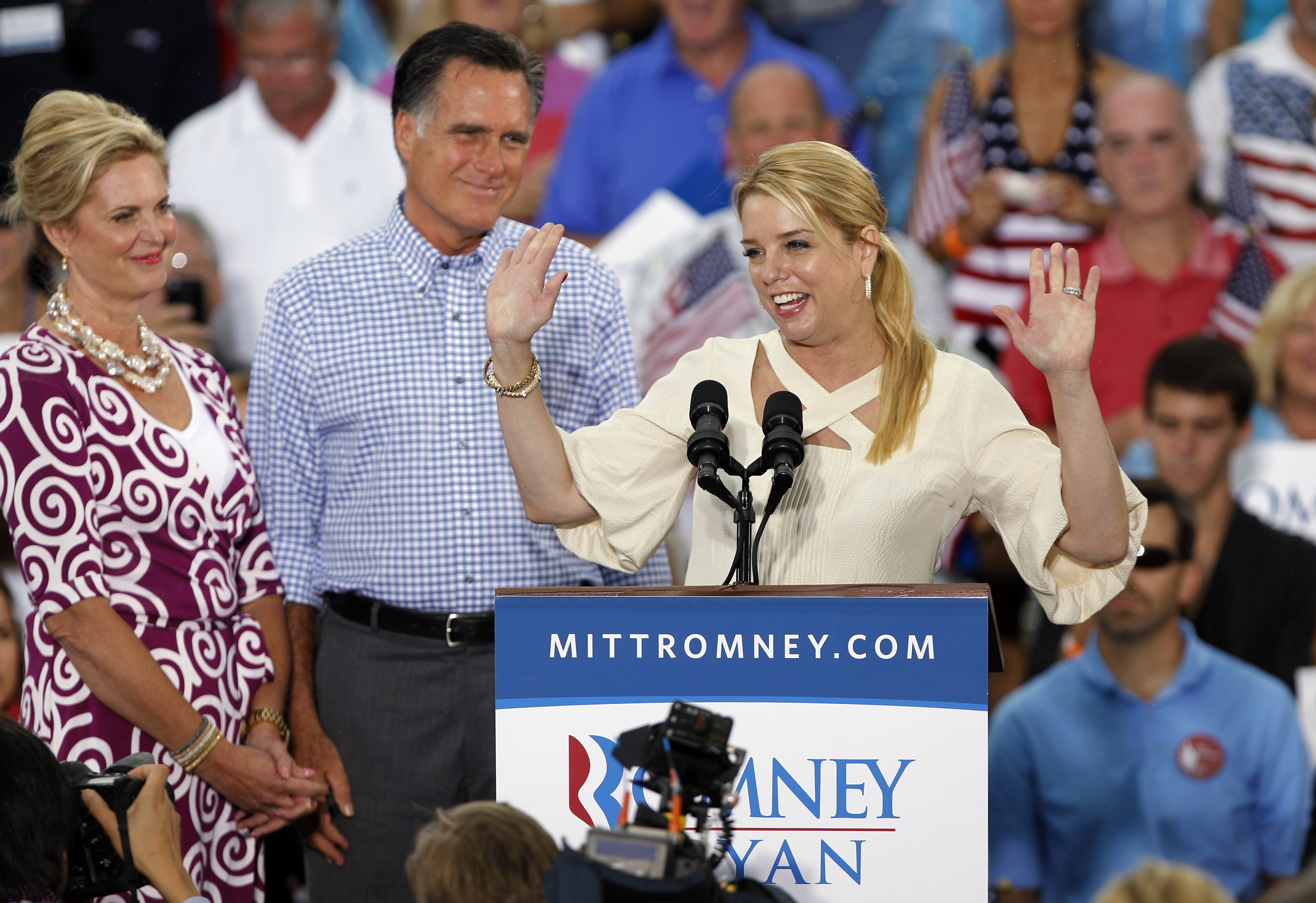 Florida attorney general Pam Bondi, right, speaks as Republican presidential candidate and former Massachusetts Gov. Mitt Romney, center, and his wife Ann, left, look on during a campaign rally, Sunday, Oct. 7, 2012 in Port St. Lucie, Fla.(AP Photo/Lynne Sladky)