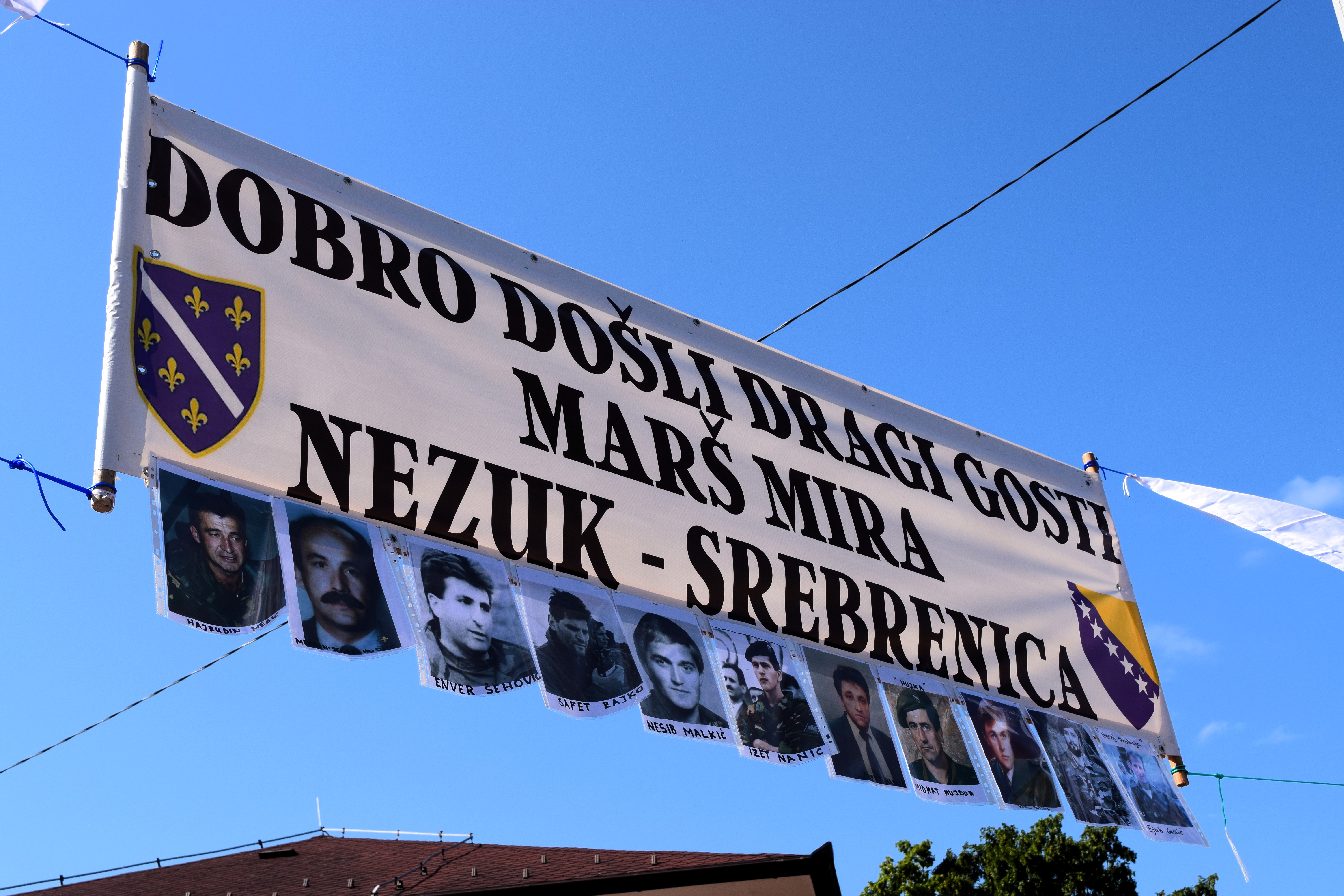 A banner flies in the village of Nezuk, where the march began on June 8