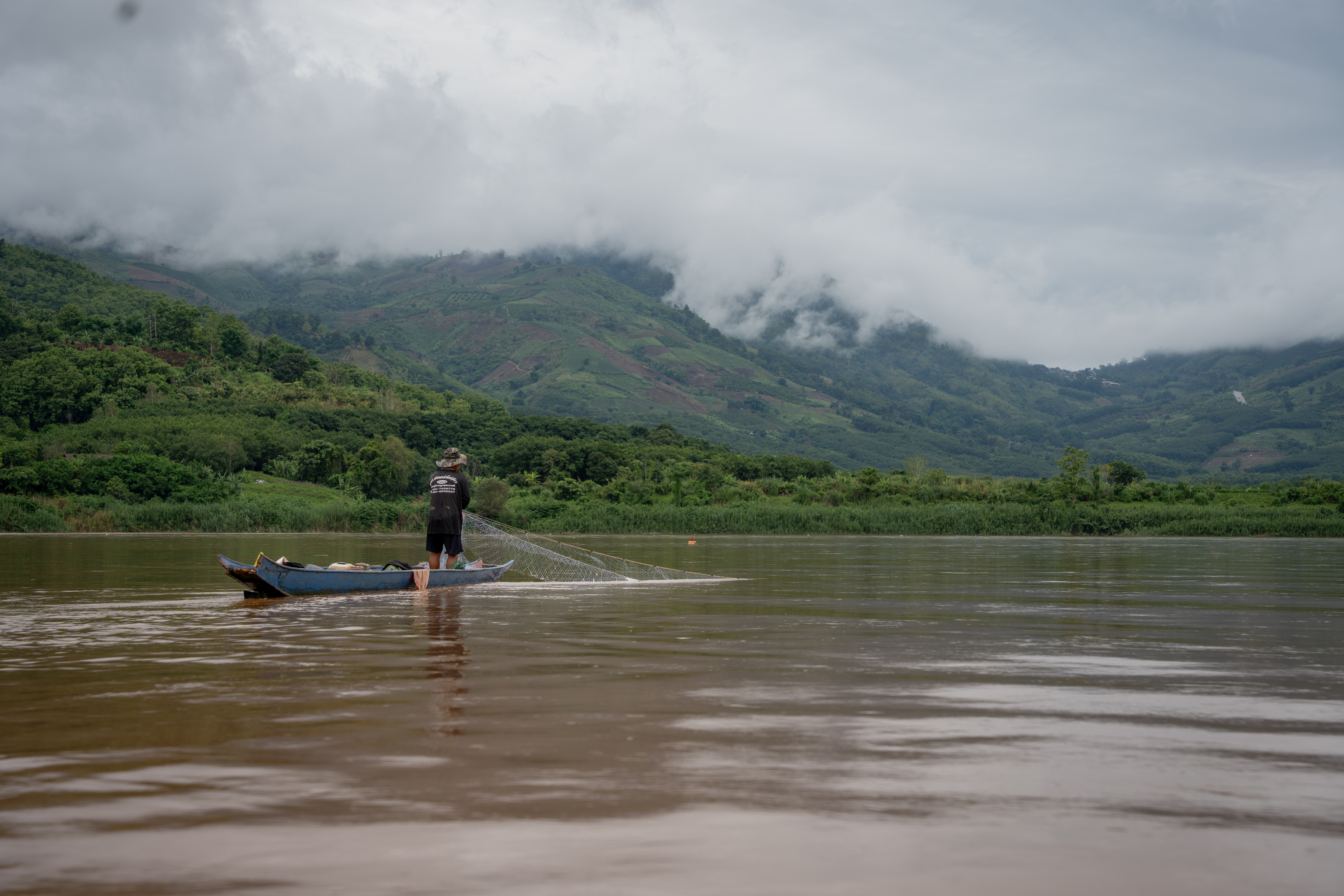 - A fisherman along the Mekong River in Bokeo Province, Laos [Al Jazeera/Fabio Polese]