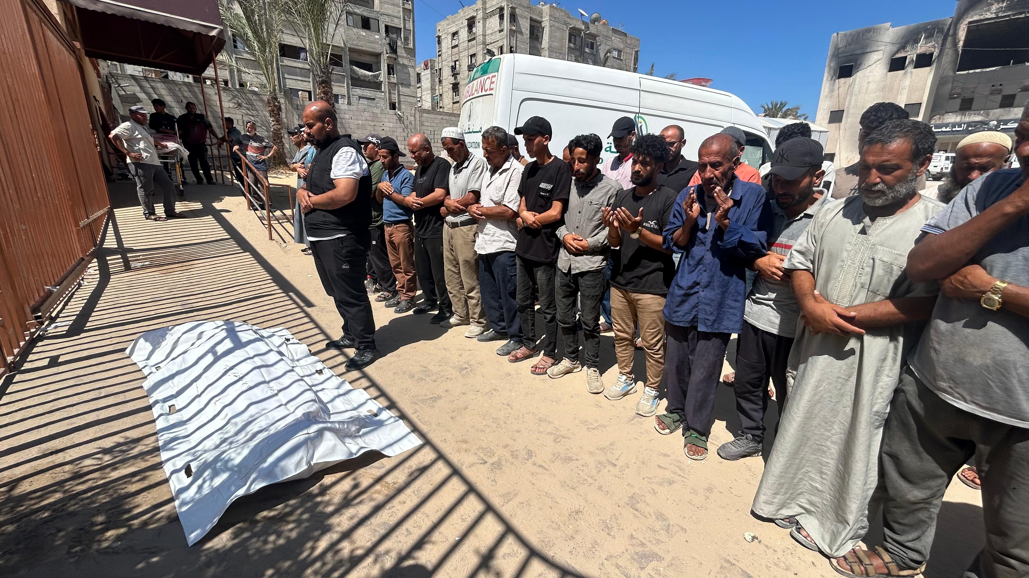 Funerals and prayers held at the hospital for the people killed while collecting aid
