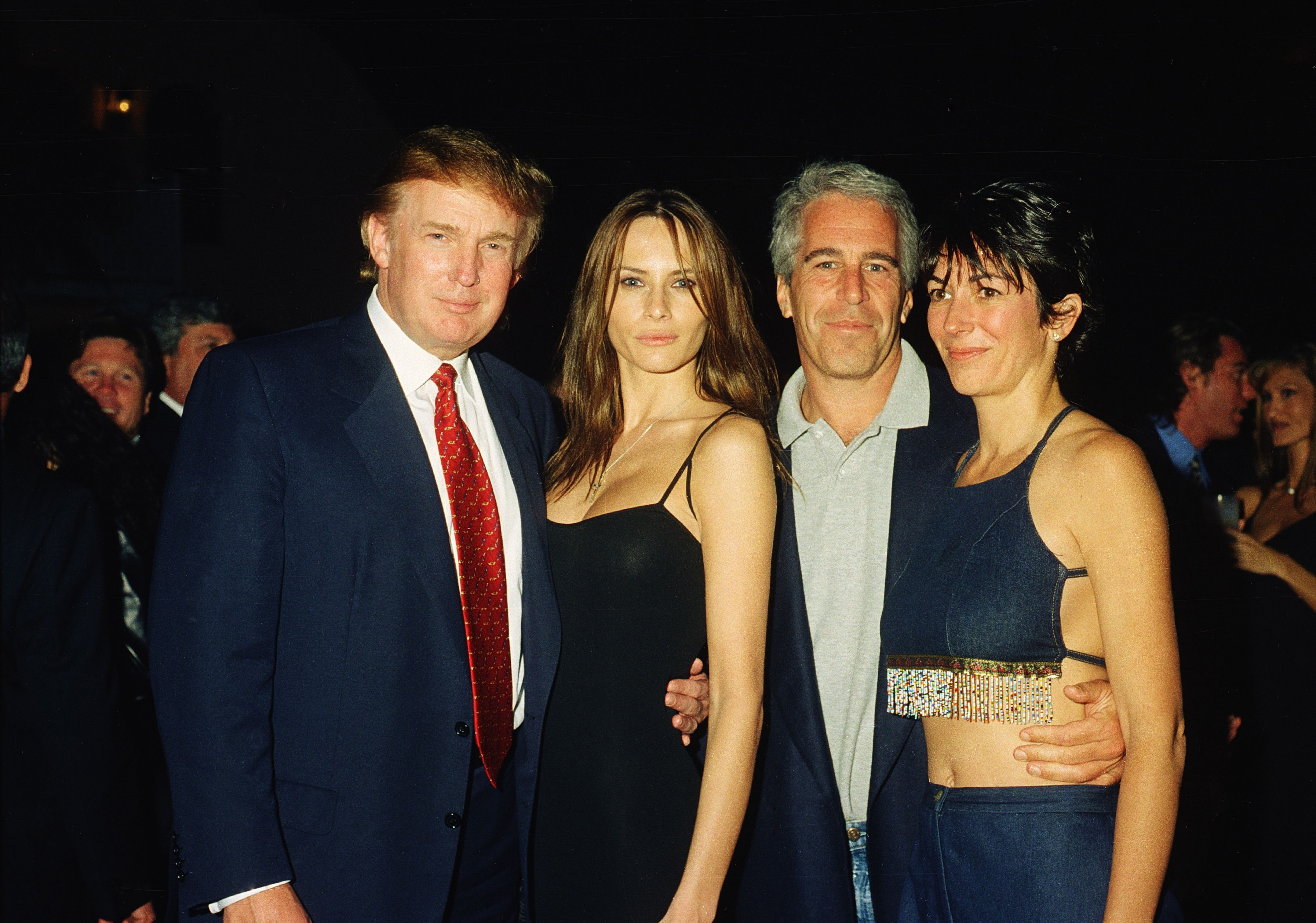 From left, American real estate developer Donald Trump and his girlfriend (and future wife), former model Melania Knauss, financier (and future convicted sex offender) Jeffrey Epstein, and British socialite Ghislaine Maxwell pose together at the Mar-a-Lago club, Palm Beach.