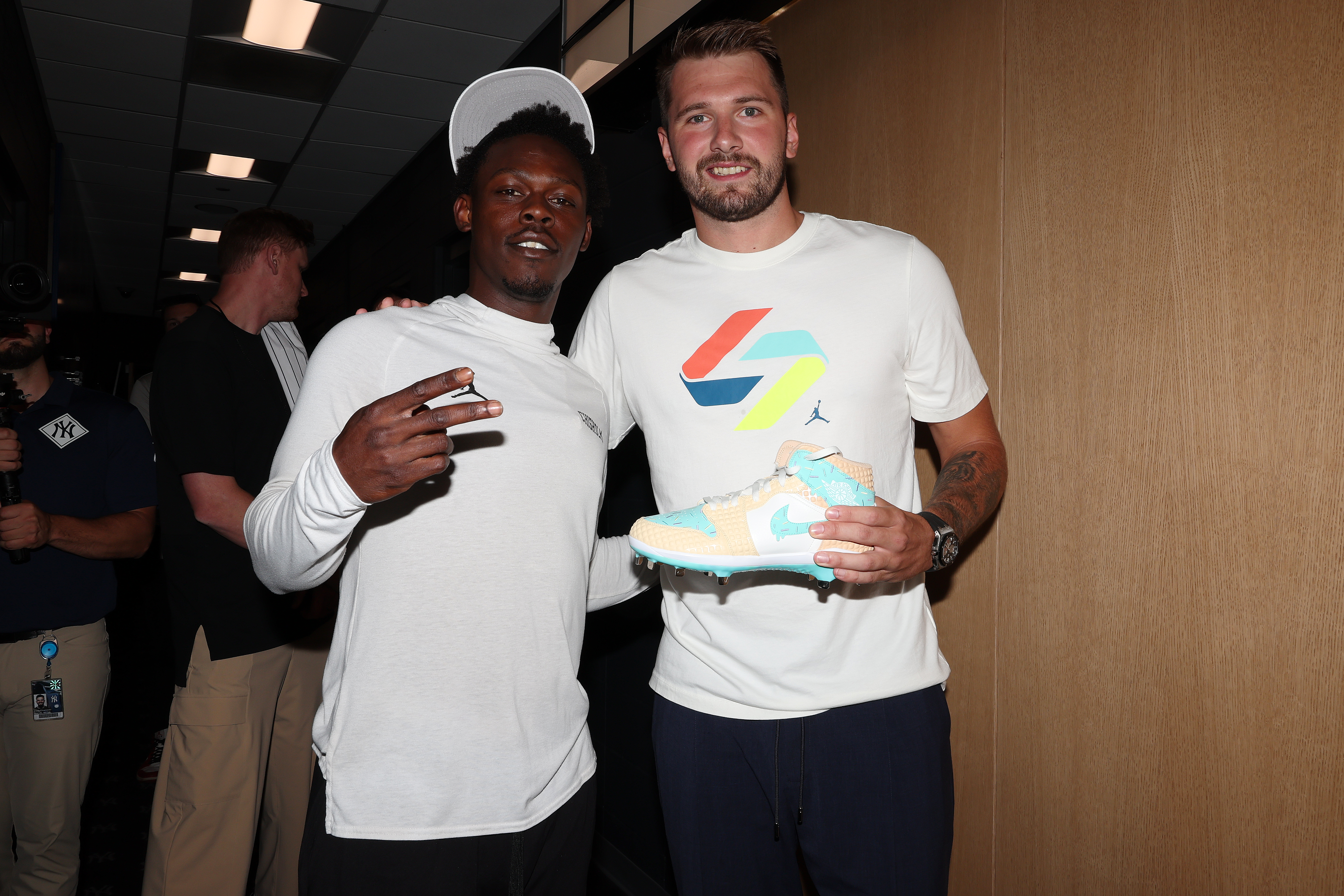 Jazz Chisholm Jr and Luka Doncic react.