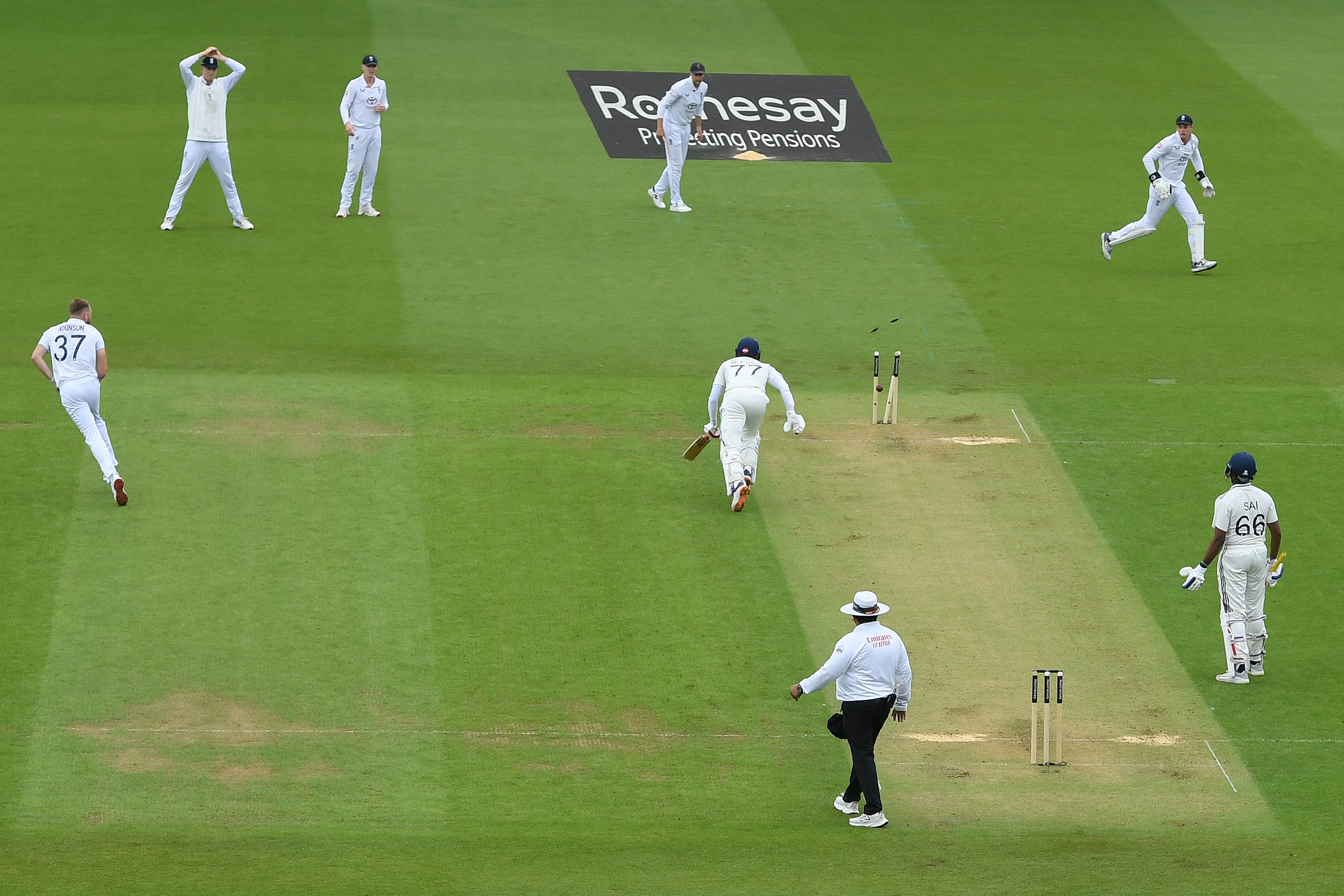 Shubman Gill of India is run out by a direct throw from Gus Atkinson of England (L) during Day One of the 5th Rothesay Test Match between England and India at The Kia Oval