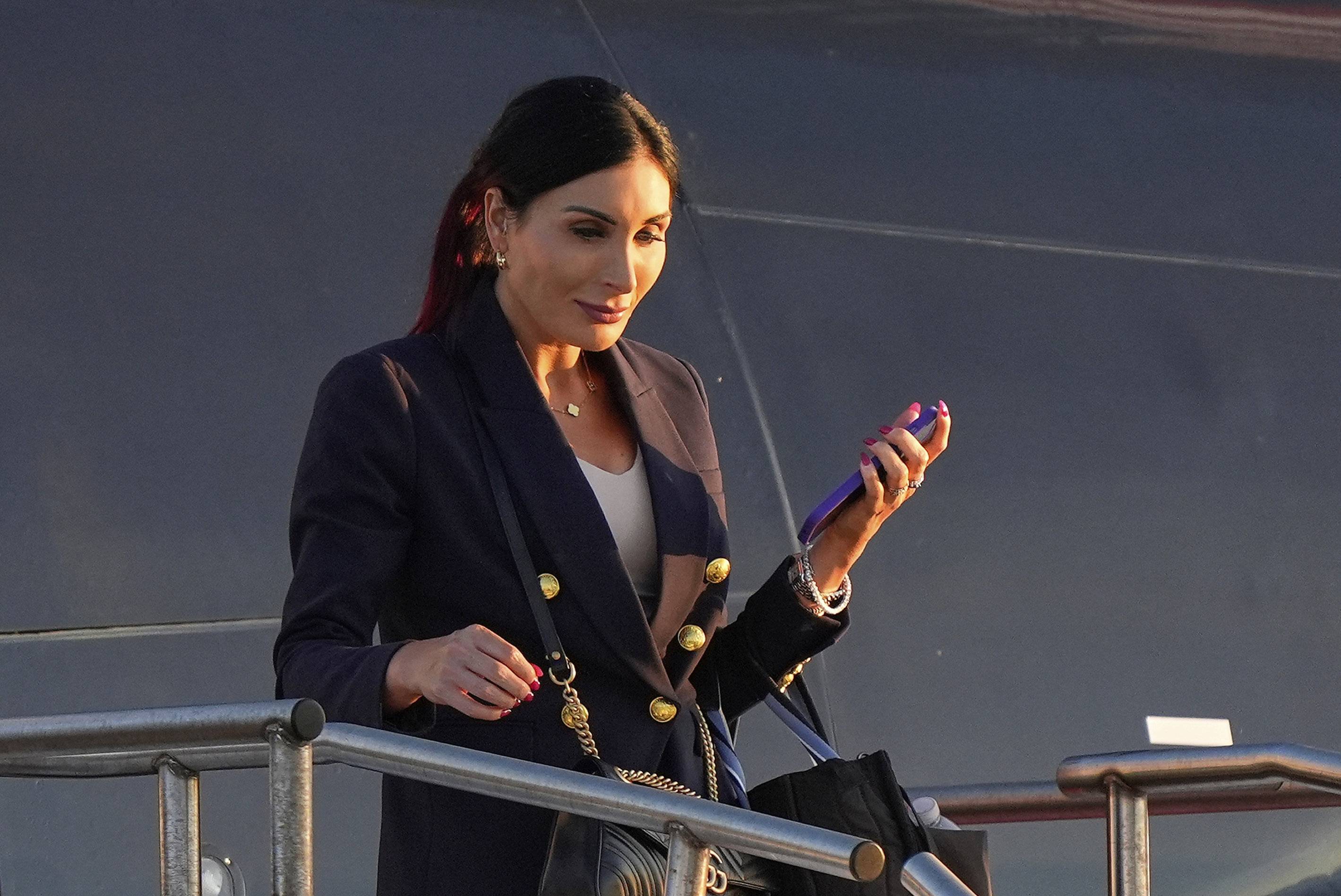 FILE - Laura Loomer arrives at Philadelphia International Airport, Sept. 10, 2024, in Philadelphia. (AP Photo/Chris Szagola, File)