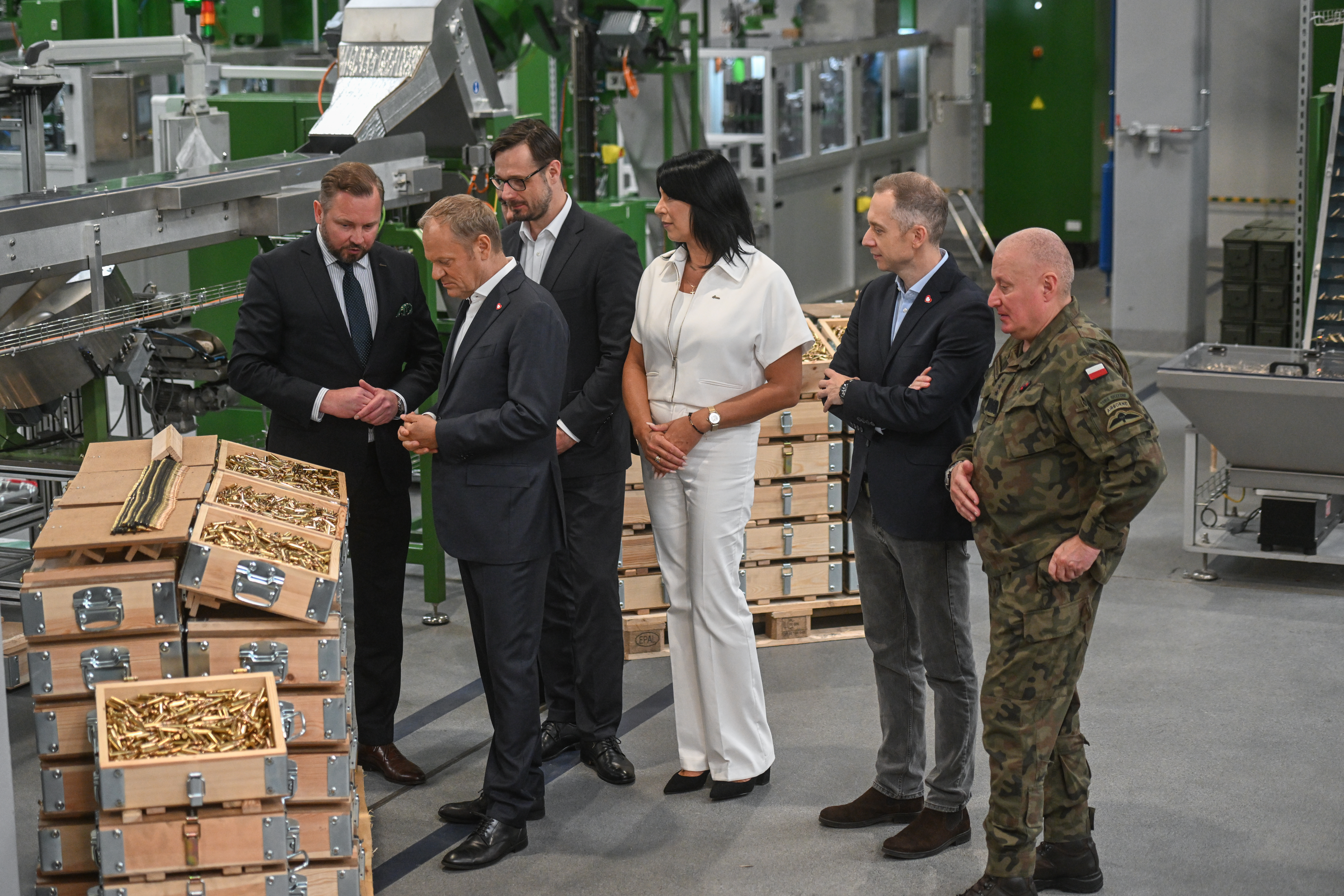 SKARZYSKO-KAMIENNA, POLAND - JUNE 13: Poland's Prime Minister, Donald Tusk inspects small caliber ammunition during the opening of Mesko SA's New Ammunition Production Hall on June 13, 2025 in Skarzysko-Kamienna, Poland. Polish Prime Minister Donald Tusk is attending the opening of a new hall for theproduction of small-caliber ammunition at Mesko SA, Polish manufacturer of ammunition and missiles. The new 4,000 square meter facility is part of 'Project 400,' aimed at increasing production capacity with four automated production lines for pistol and rifle ammunition, increasing Mesko's production capacity to 250 million pieces of ammunition per year. A number of European countries, including Poland, have significantly increased defense spending and weapons production as Russia's war in Ukraine stirs fears around security, and as US military support for Europe waivers under President Donald Trump's administration. (Photo by Omar Marques/Getty Images)