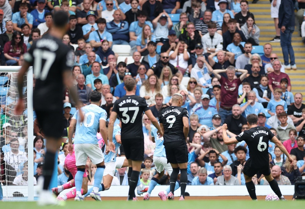 Joao Palhinha, right, of Tottenham scores the 0-2 goal during the English Premier League match between Manchester City and Tottenham Hotspur