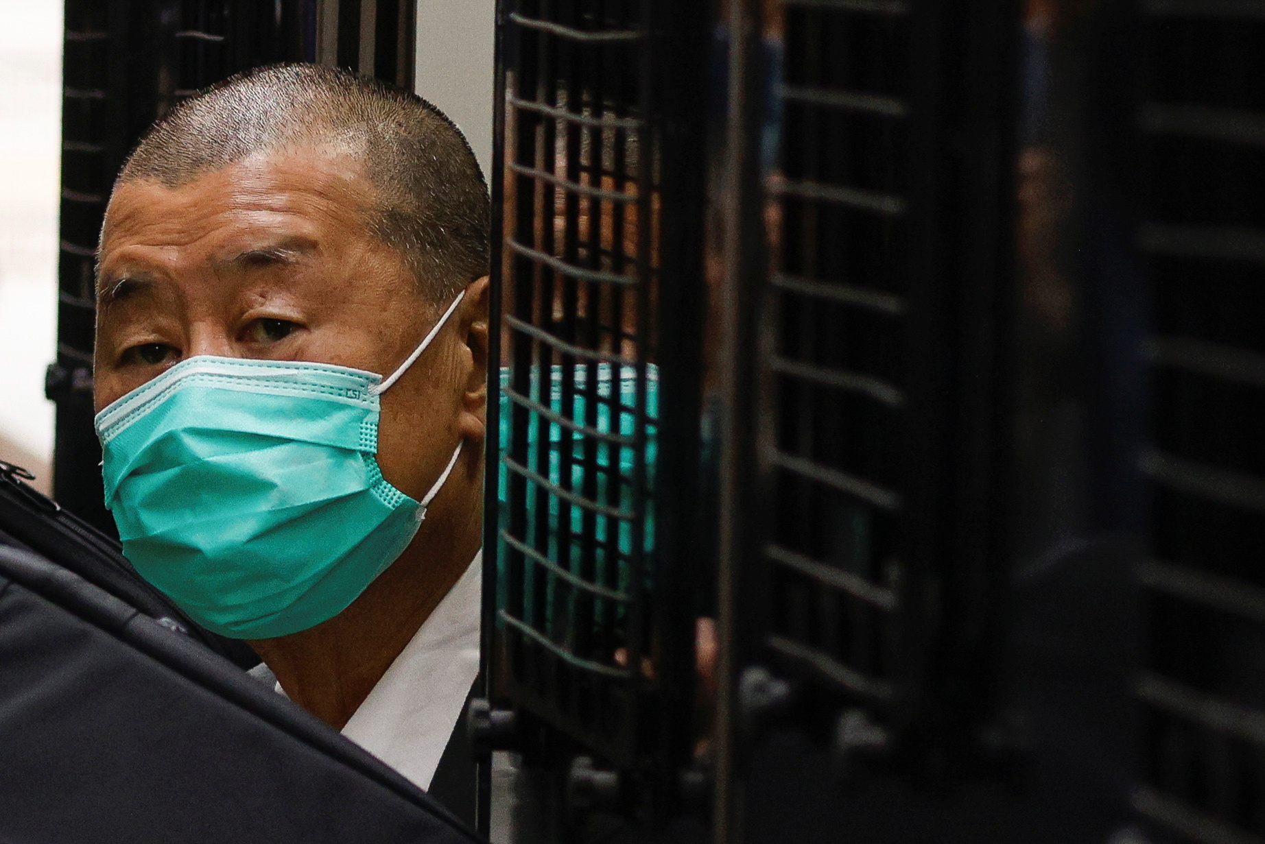 Media tycoon Jimmy Lai, founder of the now-shuttered Apple Daily, arrives at the Court of Final Appeal by prison van in Hong Kong in 2021 [File: Tyrone Siu/Reuters]