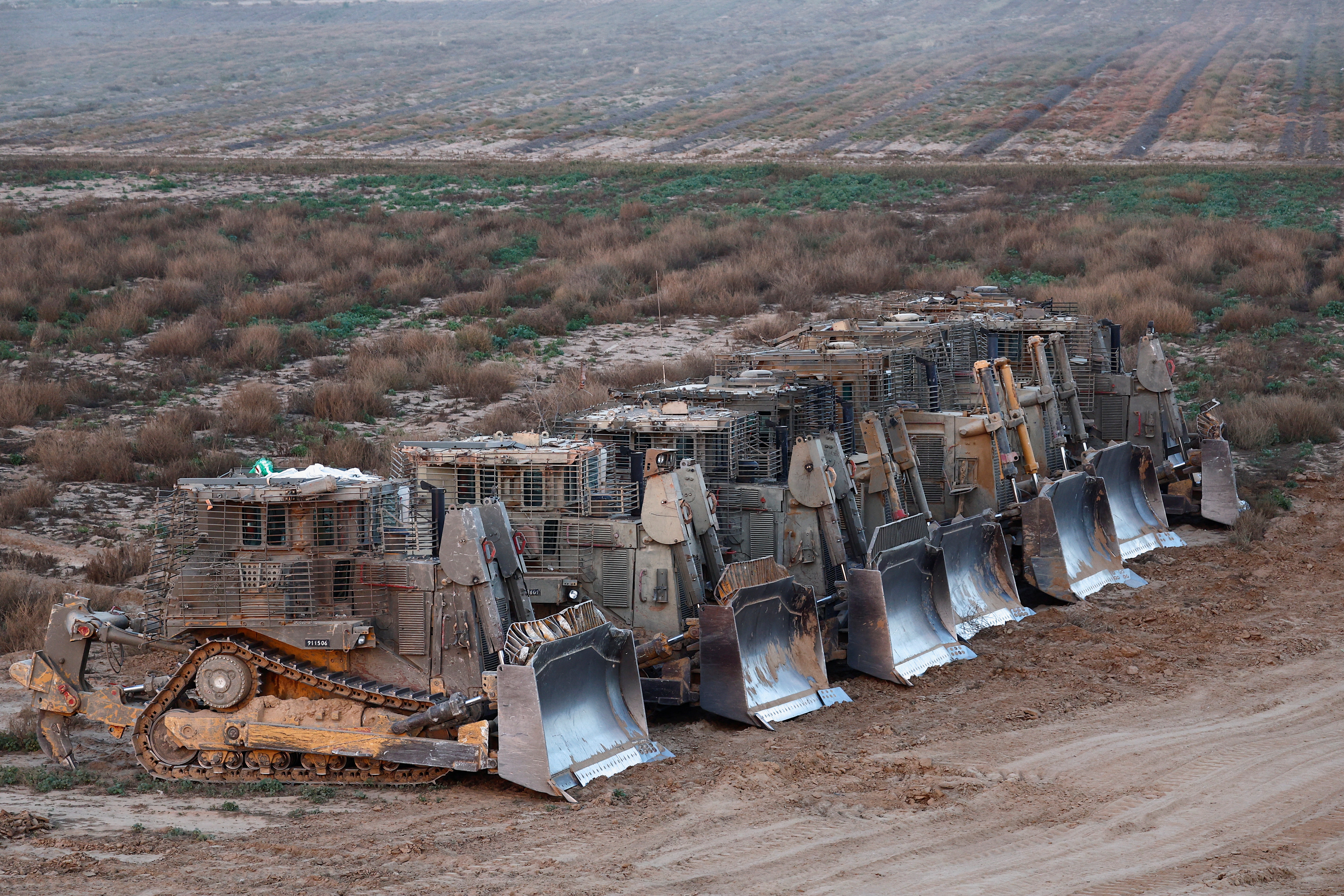 D9 bulldozers are parked near the Israel-Gaza separation