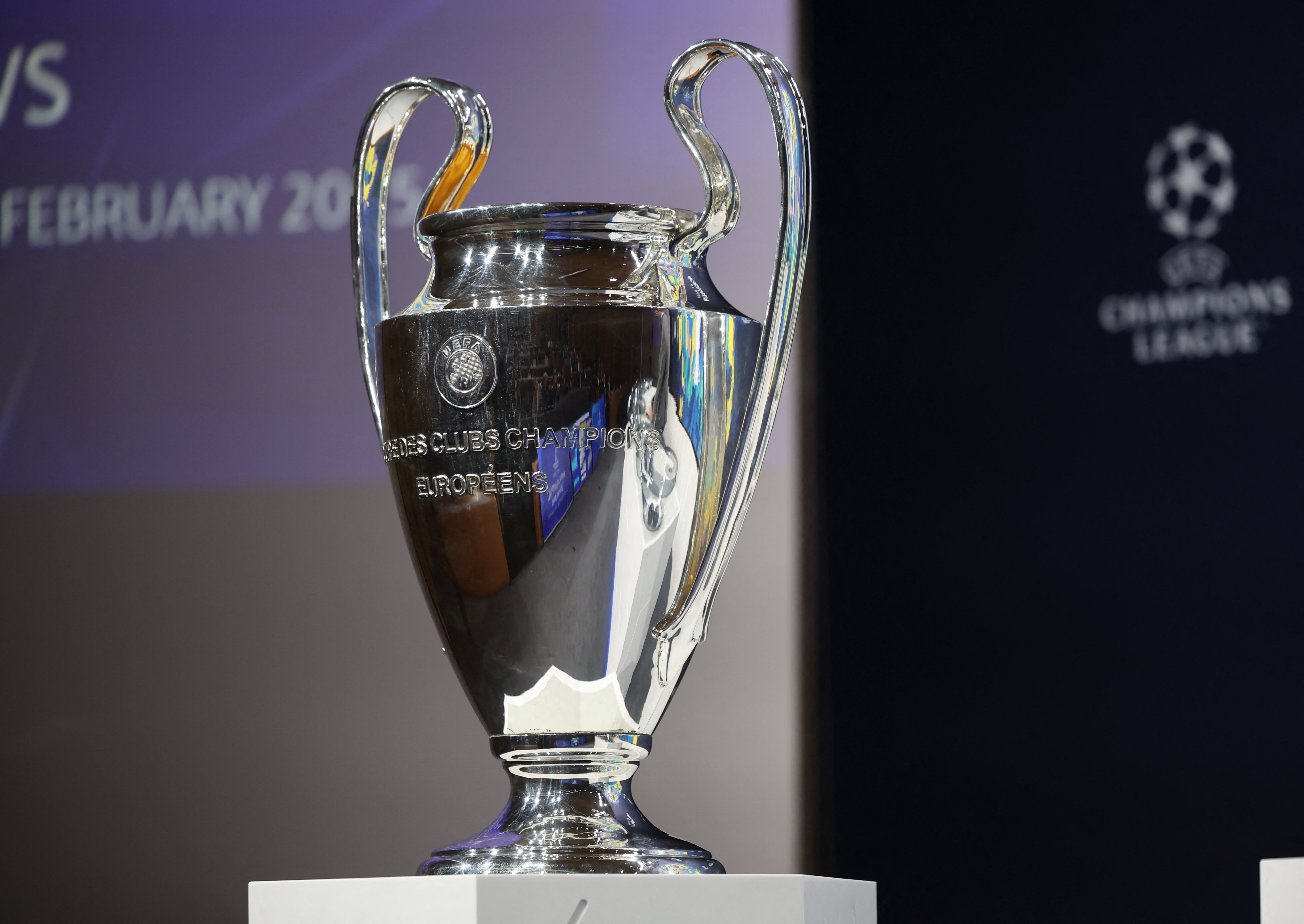 The Champions League trophy is displayed before the start of the draw