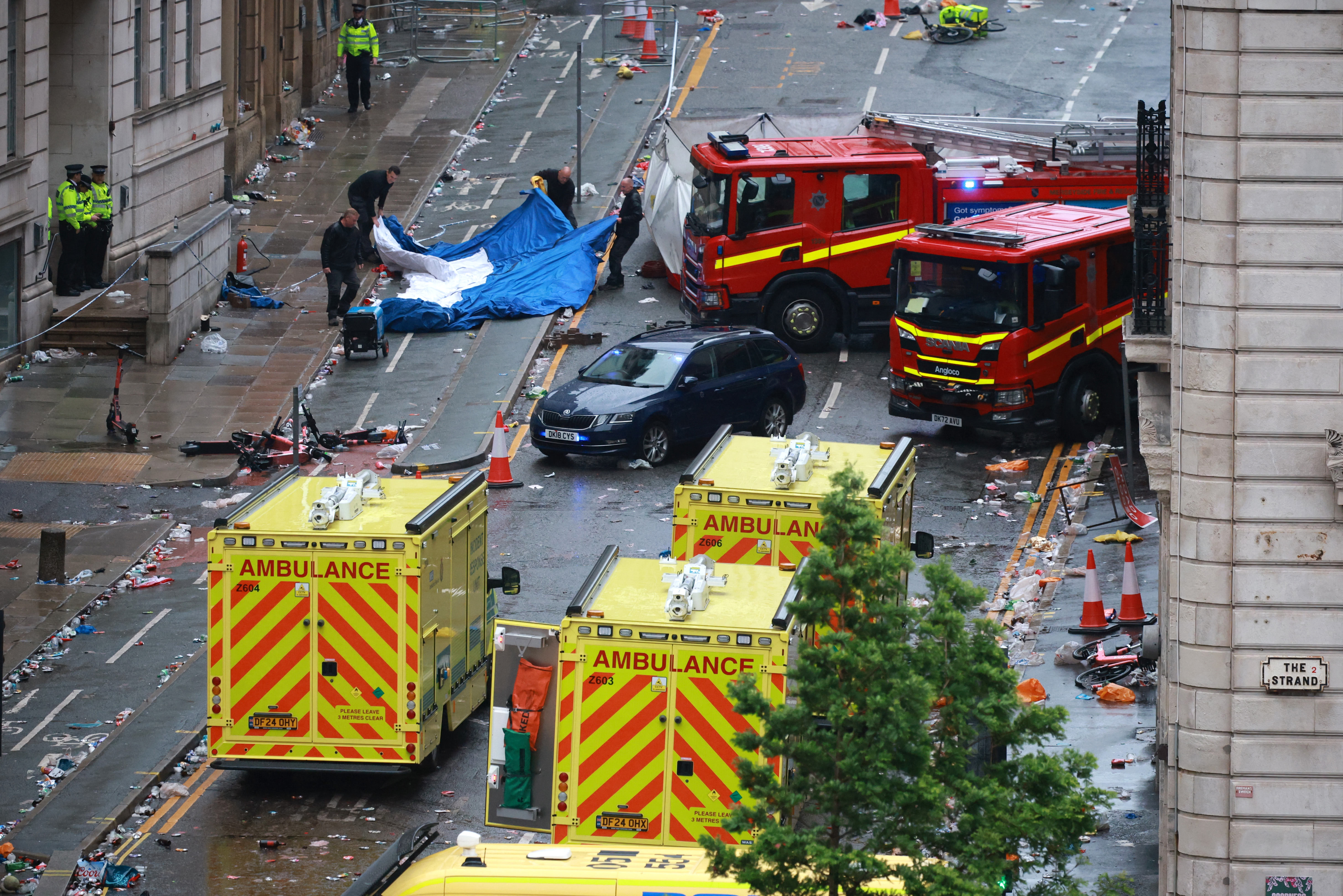 mergency services at the scene after multiple people were hit by a car during the Liverpool Premier League victory parade