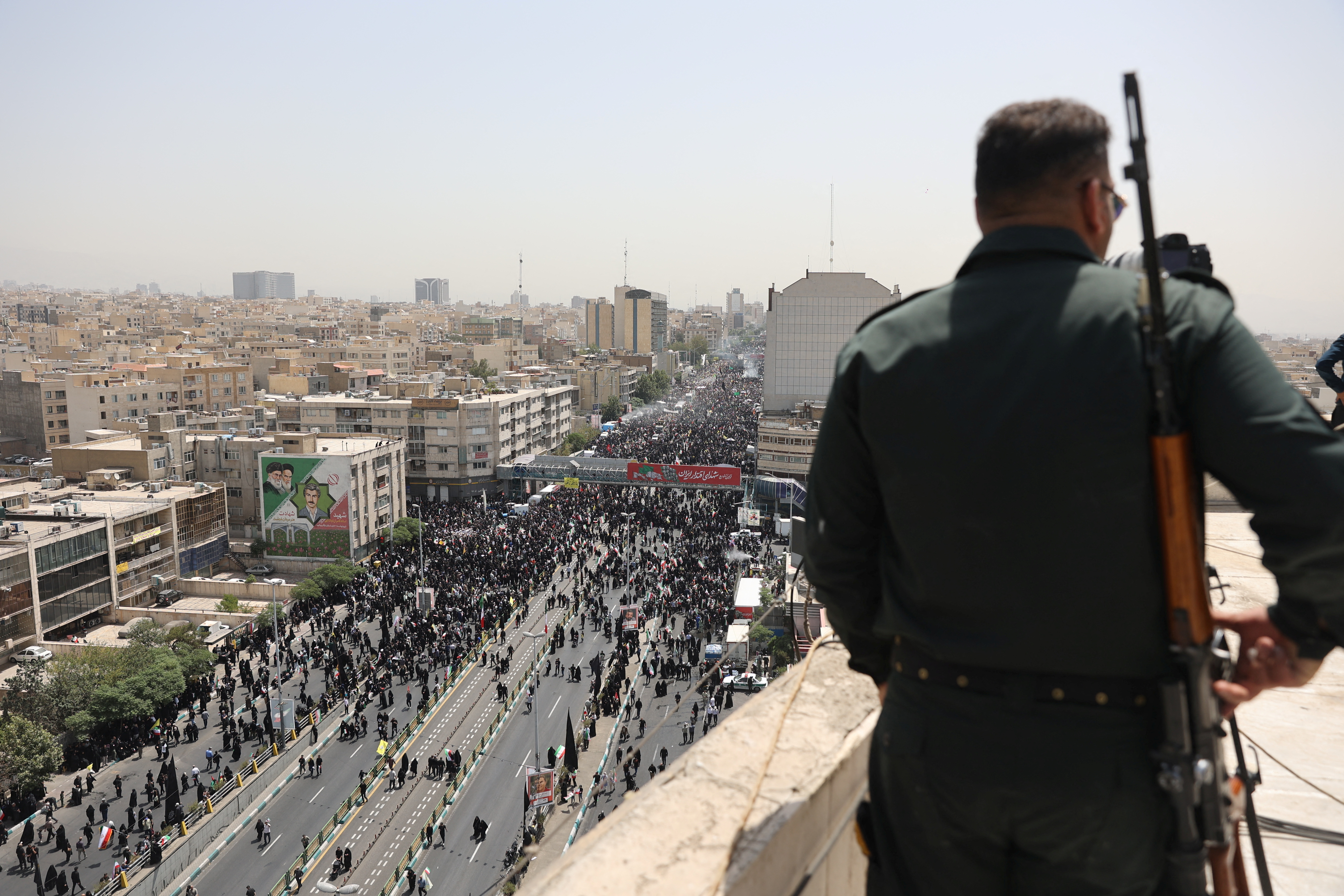 People attend the funeral procession of Iranian military commanders, nuclear scientists and others killed in Israeli strikes, in Tehran, Iran